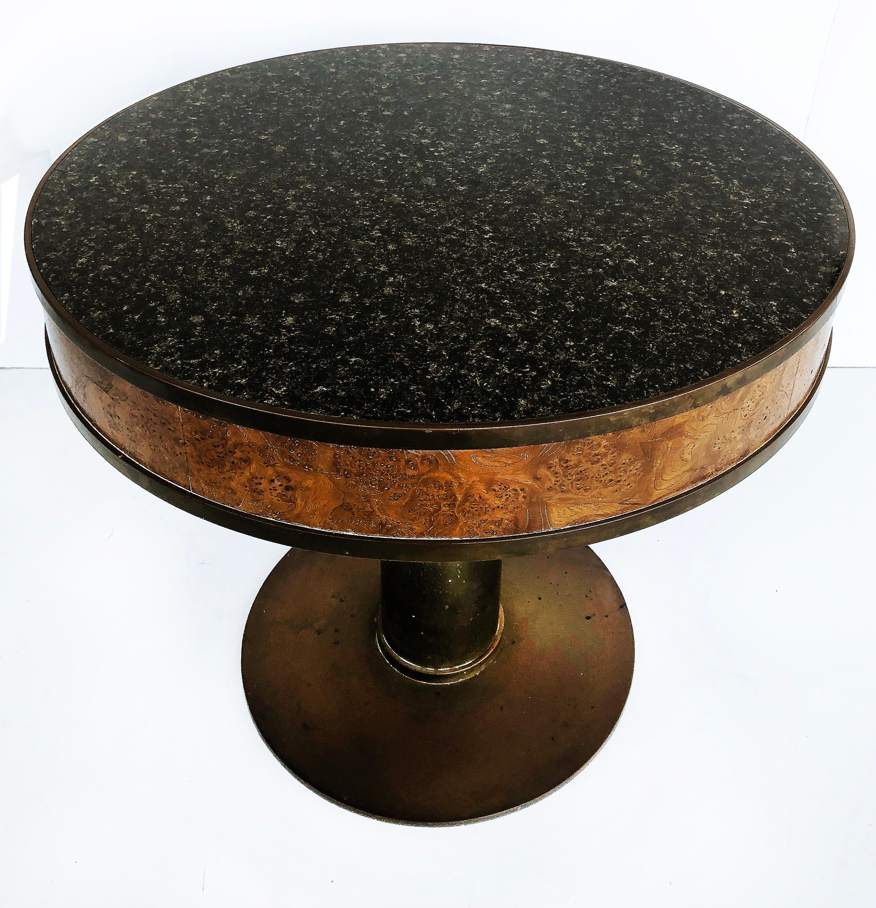 Bronze Burl Pedestal Gueridon side table with Faux Granite Laminate top

Offered for sale is a bronze and burl wood pedestal side table or gueridon with an inset faux granite laminate top. The burl wood table apron is surrounded top and bottom