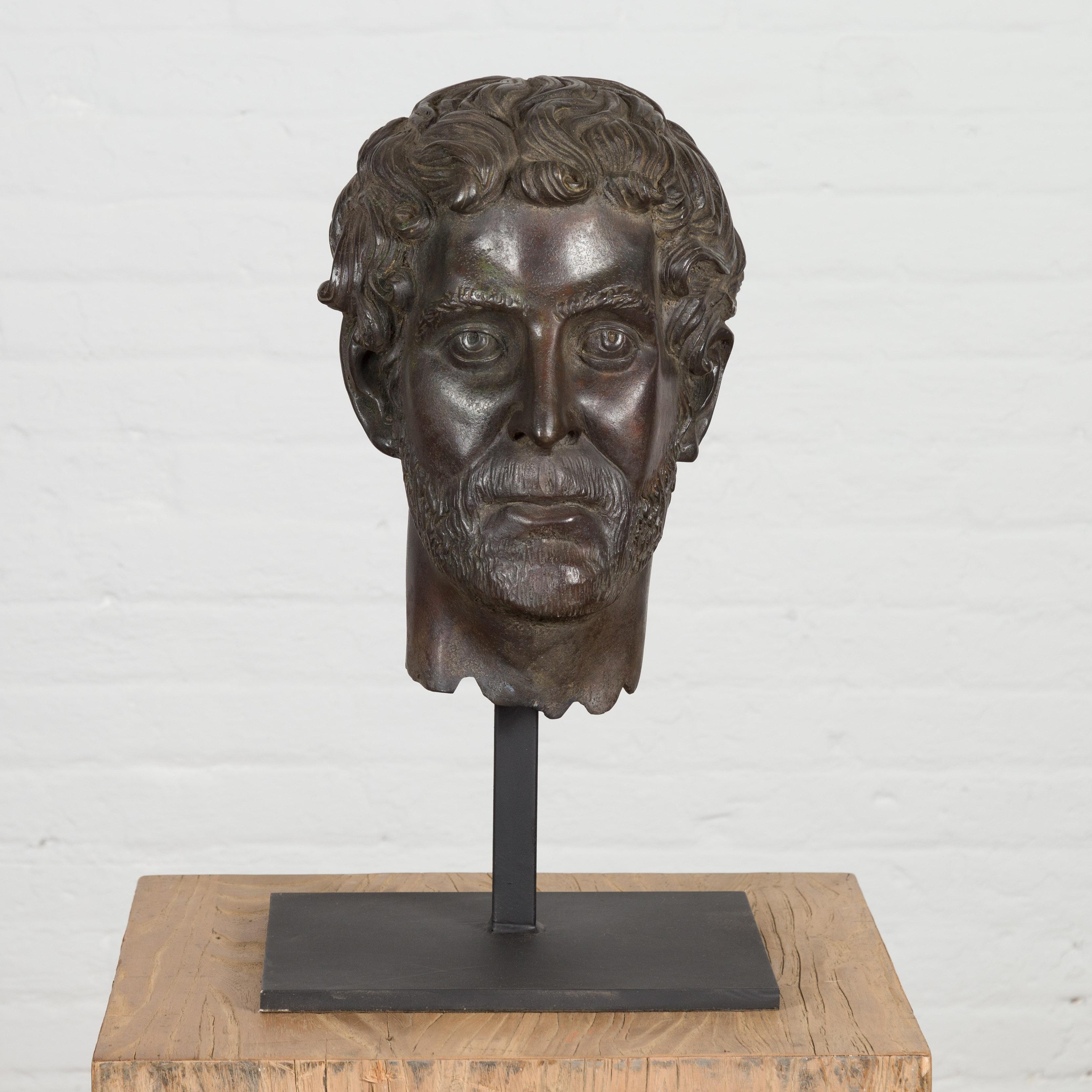 A lost wax cast bronze bust sculpture of a Roman Emperor, possibly Antoninus Pius on custom base. Elevate your space with the timeless elegance of this lost wax cast bronze bust sculpture of a Roman Emperor, possibly Antoninus Pius. This