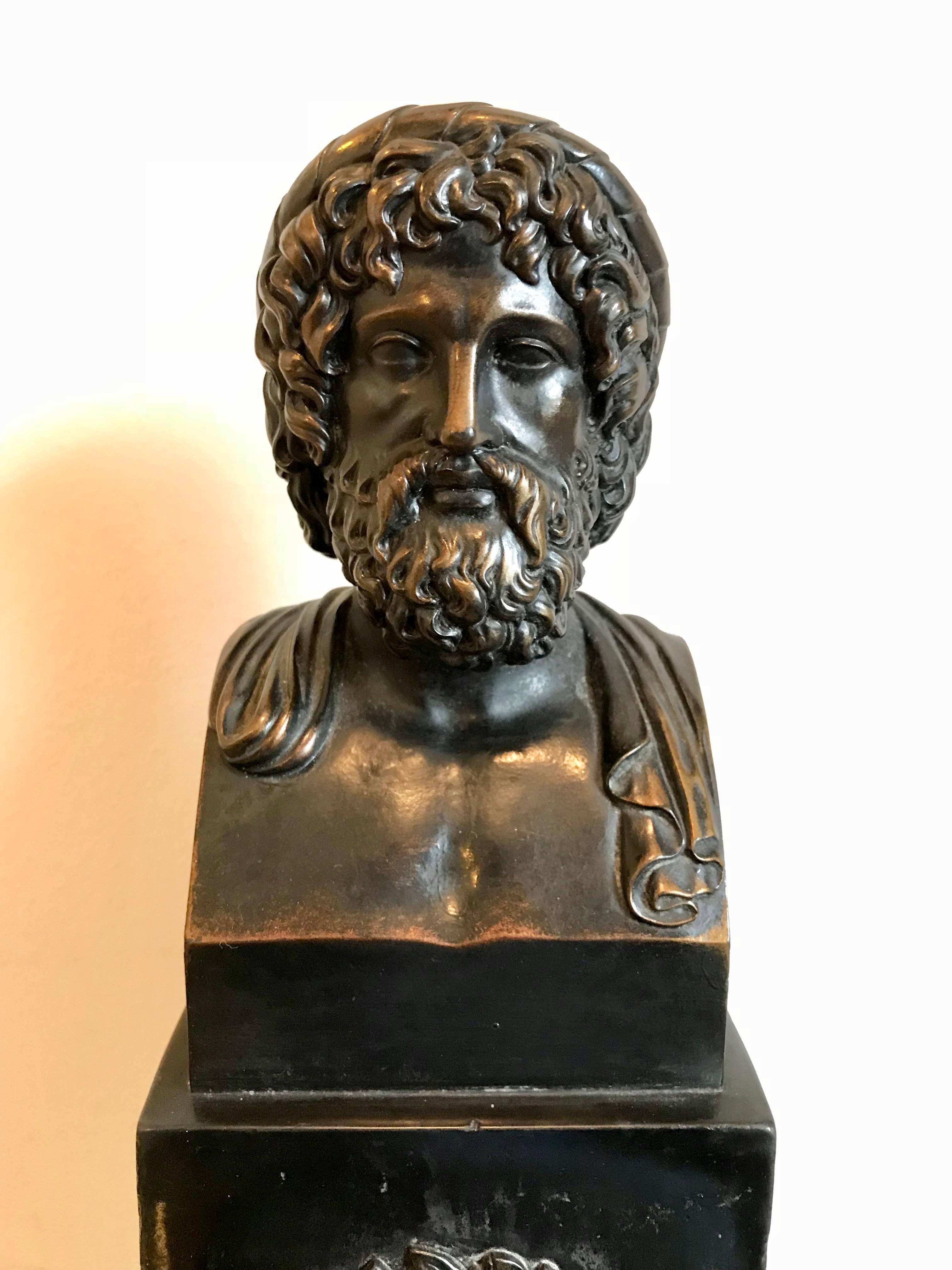 High quality Grand Tour bronze bust of Asclepius depicting the bearded Greek god on a faux marble Scagliola plinth. Modelled after an ancient Roman marble original. The black stepped base with a laurel wreath in relief.
A great gift for your