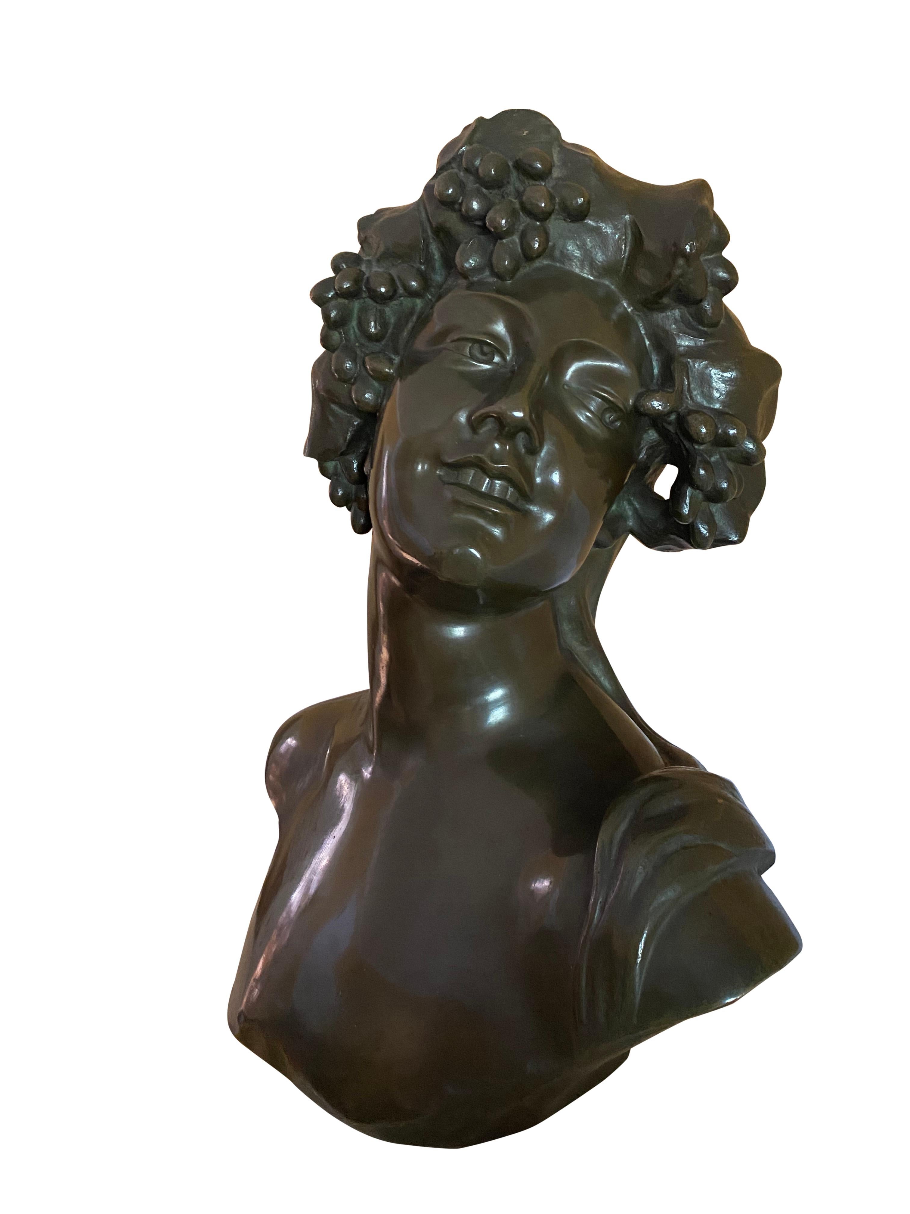 Bronze bust of Bacchus the god of wine and intoxication, 19th century. Bacchus, also known as Dionysus was the Greek god of wine, inebriation, fertility and theatre. He is known to be joyous and kind to those who admire him, yet cruel and