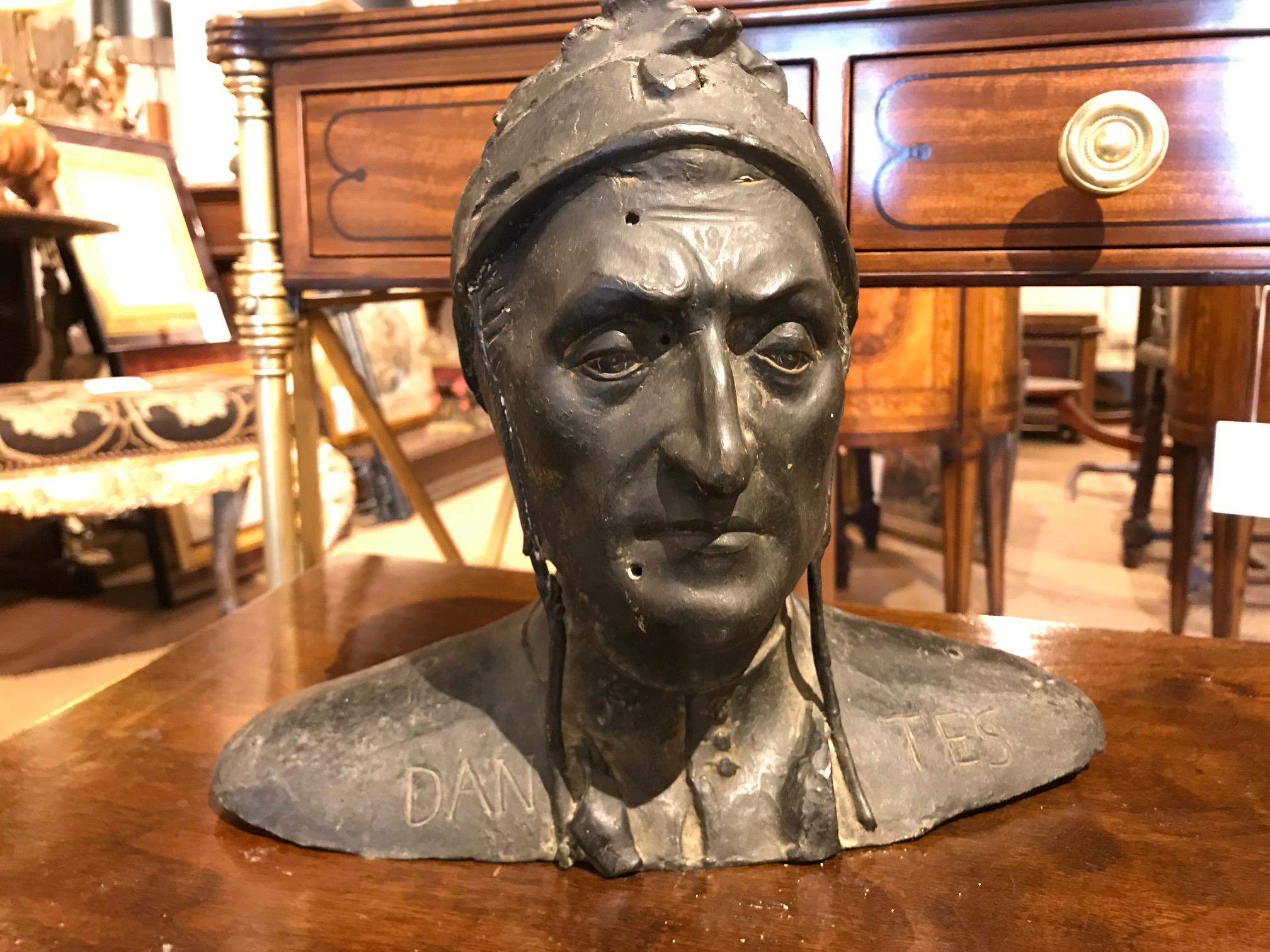 Italian Grand Tour bronze bust of Dante Alighieri after a Renaissance original with his name impressed across the front of the oval base, long cap protruding at rear. Patina intact, there is a hole at top of head that appears original to casting.
A