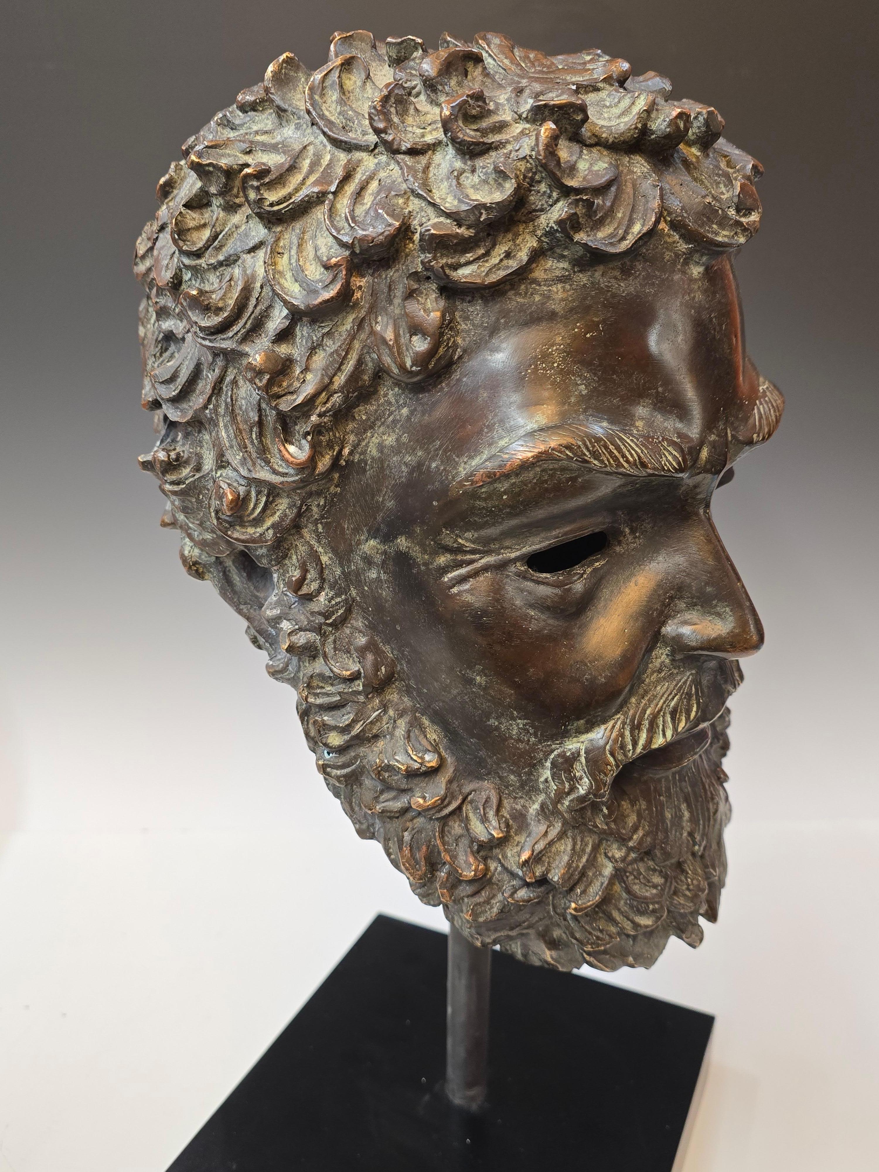 Life size patinated bronze bust of Zeus,  After the antiquity examples.   Stunning patination mounted on a laminate covered base, bottom of base looks like mahogany. 