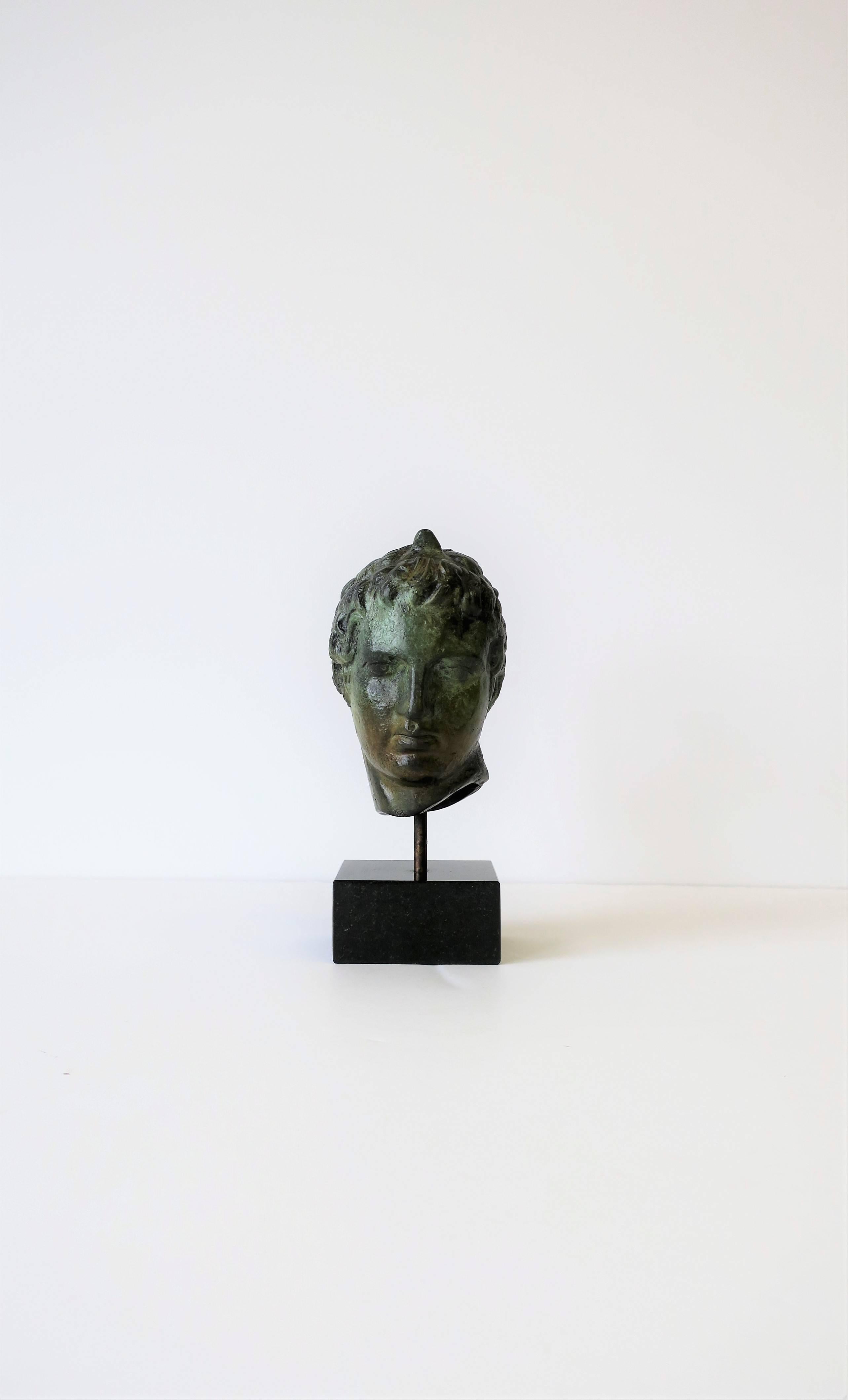 A small but substantial bronze male bust sculpture on a black marble base. Excellent condition. 

Piece measures: 3 in. W x 4 in. D x 6.5 in. H.

 