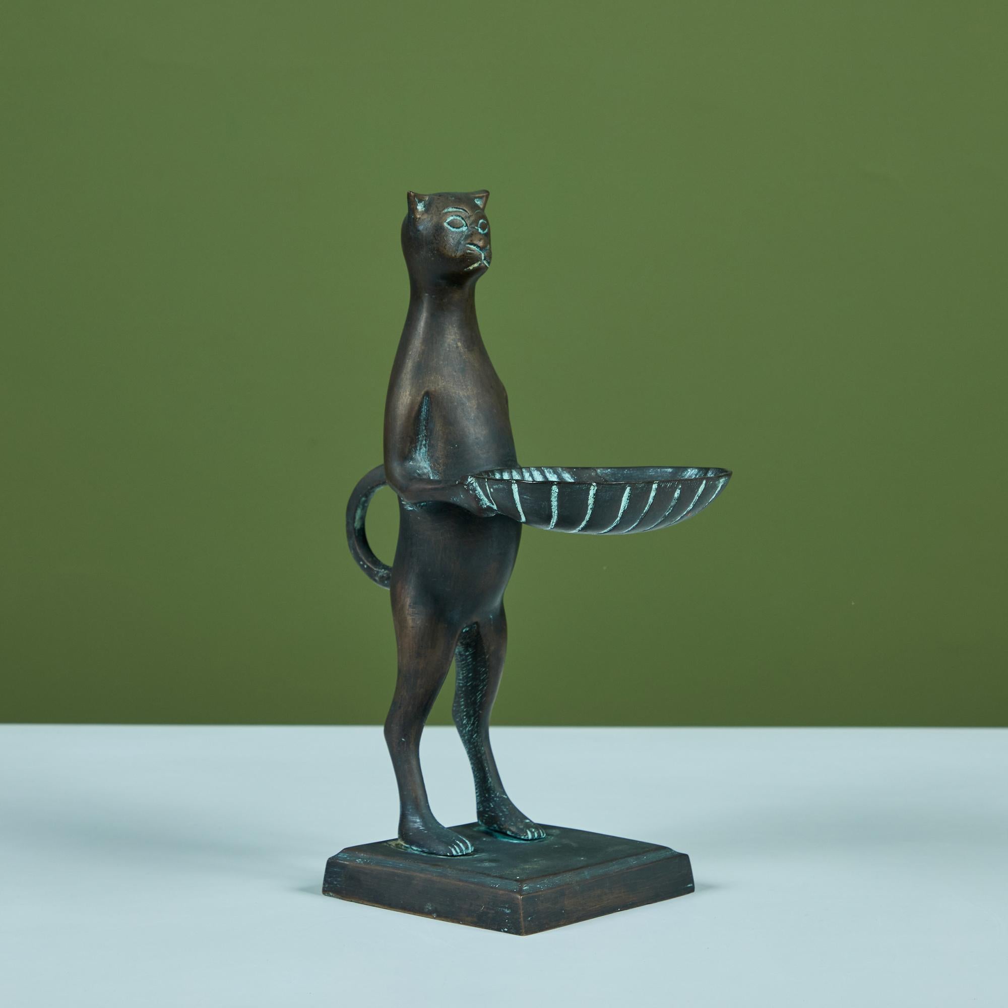 Bronze mounted sculpture in the style of Diego Giacometti. The sculpture showcases a cat figure holding a small shell tray perfect for dropping trinkets and keys.

Dimensions
4
