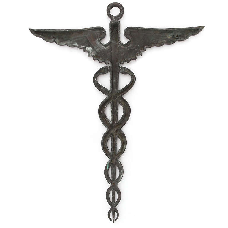 A beautifully cast and warmly patinated bronze caduceus of good scale.