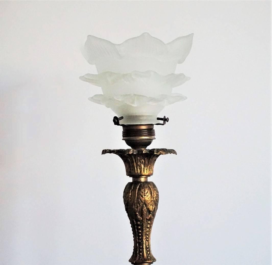 Art Nouveau solid bronze candelabra on large decorative base with tulip frosted glass shade. The candelabra has been converted to electric in the 1930s. 

Measure: Height 18.50 in (47 cm)
Base width/depth 8 in (20 cm)
Glass shade diameter 5.15