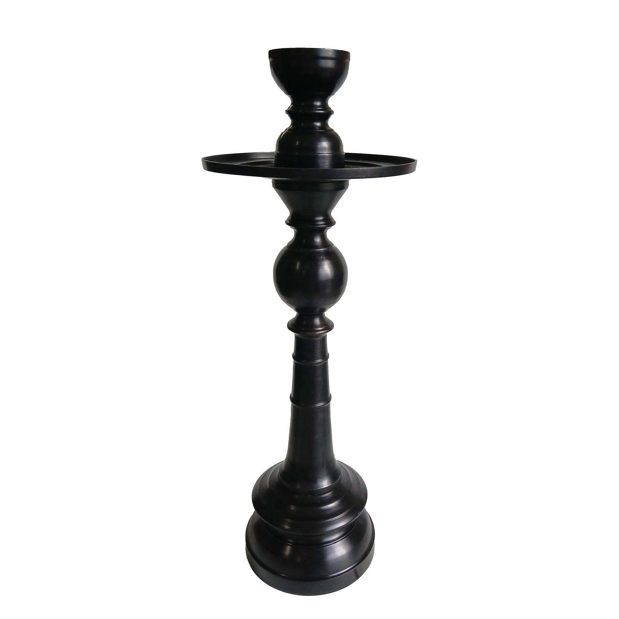 A medium-size candlestick in forged bronze with black satin finish. Indonesia, contemporary.

The 9-inch diameter top plate is designed to hold pillar candles up to 6 inches in diameter. 
It also  includes a removable top that holds candles up to 3