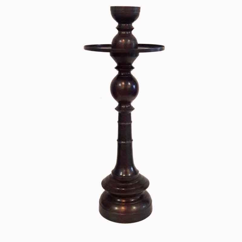A tall bronze candlestick in forged bronze. Contemporary. The 9-inch diameter top plate is designed to hold large size candles, and includes a removable top that holds smaller size candles. 25 inches tall, with a seven-inch base. A stunning accent