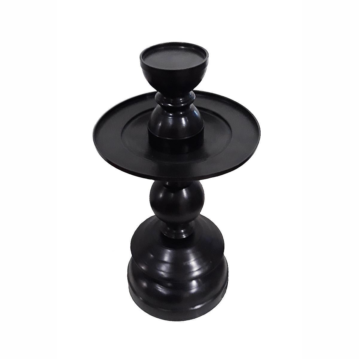 A medium-sized candlestick in forged bronze, black finish. Contemporary. The 9.5-inch diameter top plate is designed to hold large size candles, and includes a removable top that holds smaller size candles. 17.5 inches tall, with a 9-inch base. A