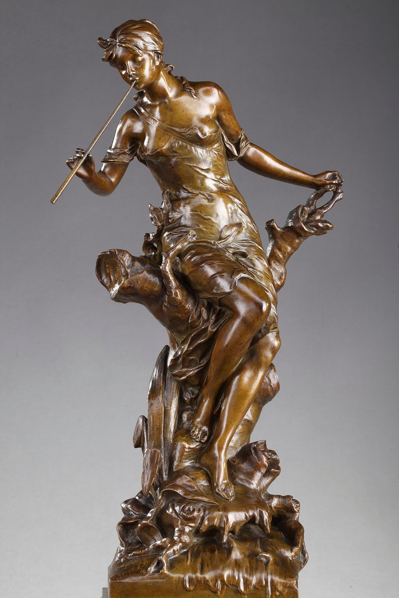 Late 19th century Art Nouveau period bronze casting with brown patina by Édouard Drouot. This allegorical sculpture for which the artist received a medal, features a young woman sitting on a branch near a river, and playing the flute. Signed: E.