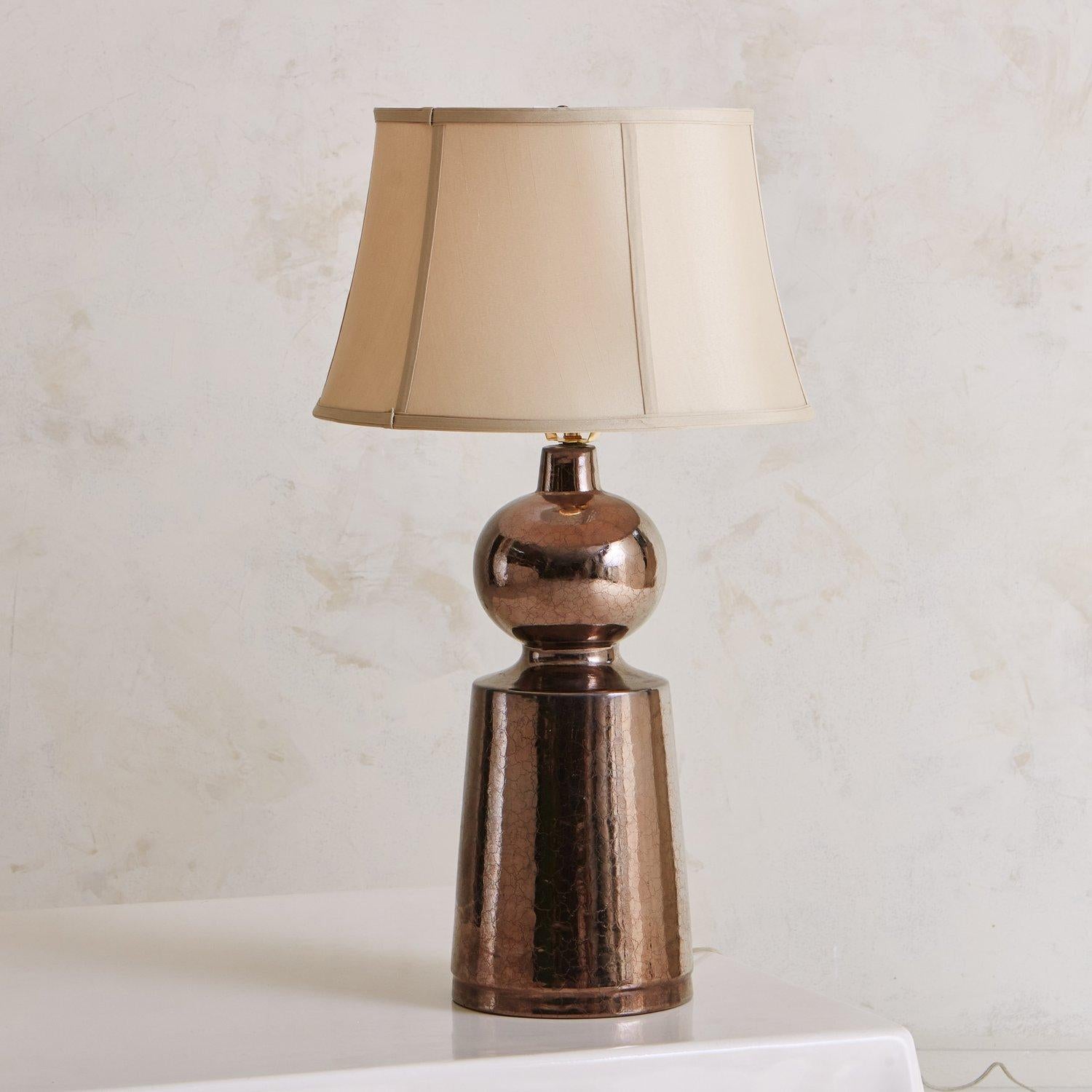A sculptural bronze ceramic lamp with a beautiful mirror glaze finish. A beautiful accent piece for a living room or bedroom. Sourced in France, 20th Century.