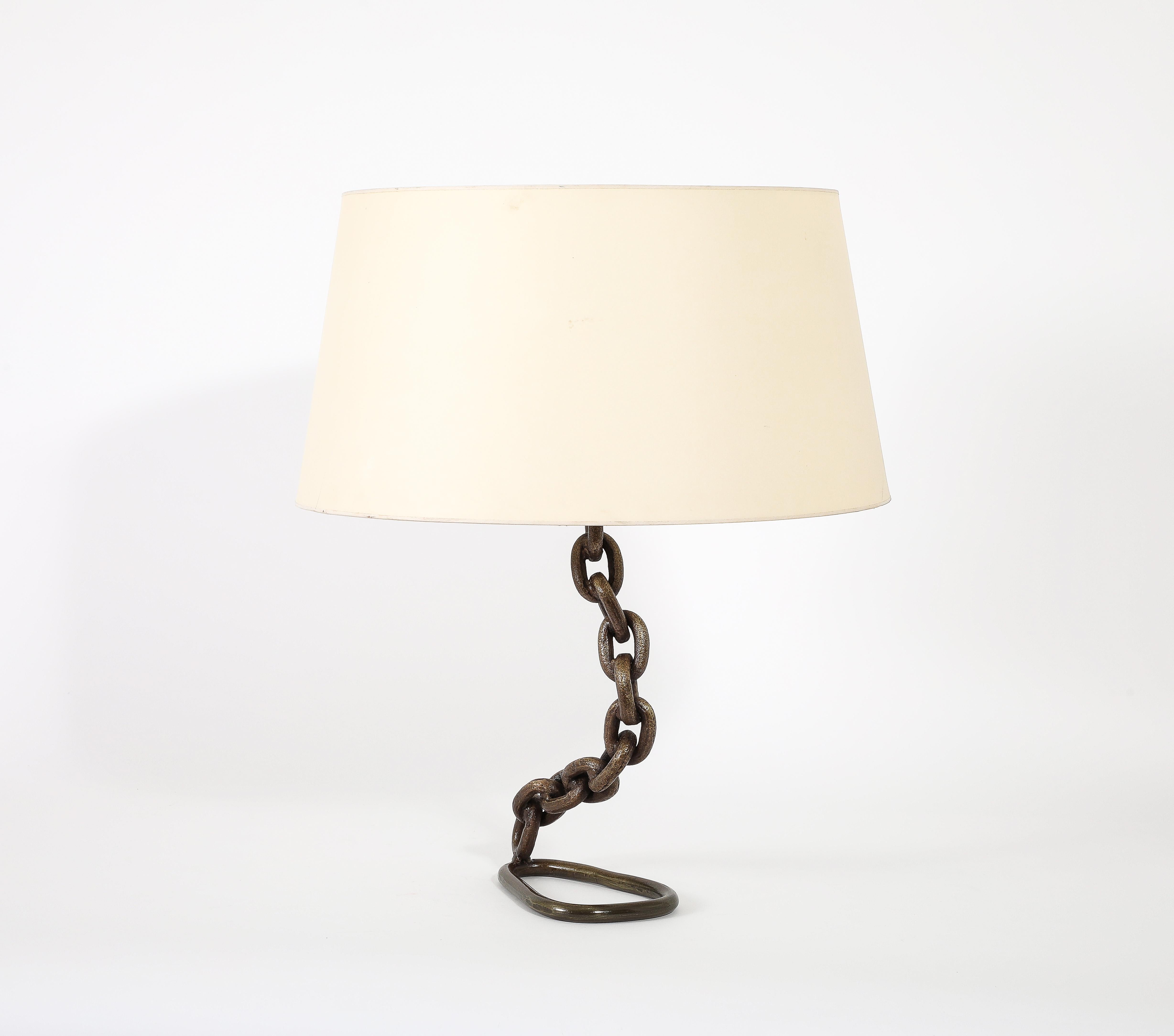 Large Bronze chain table lamp with an asymmetrical base.

Base only 20x8x4

