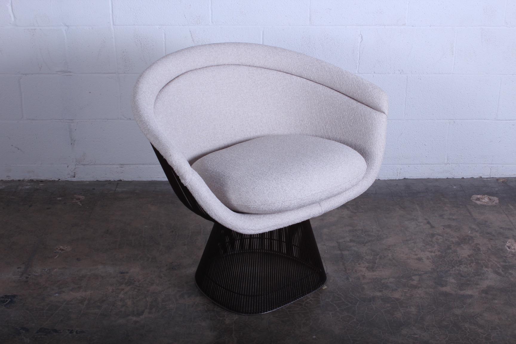 A bronze armchair designed by Warren Platner for Knoll. Newly upholstered. Nice patina to frame.