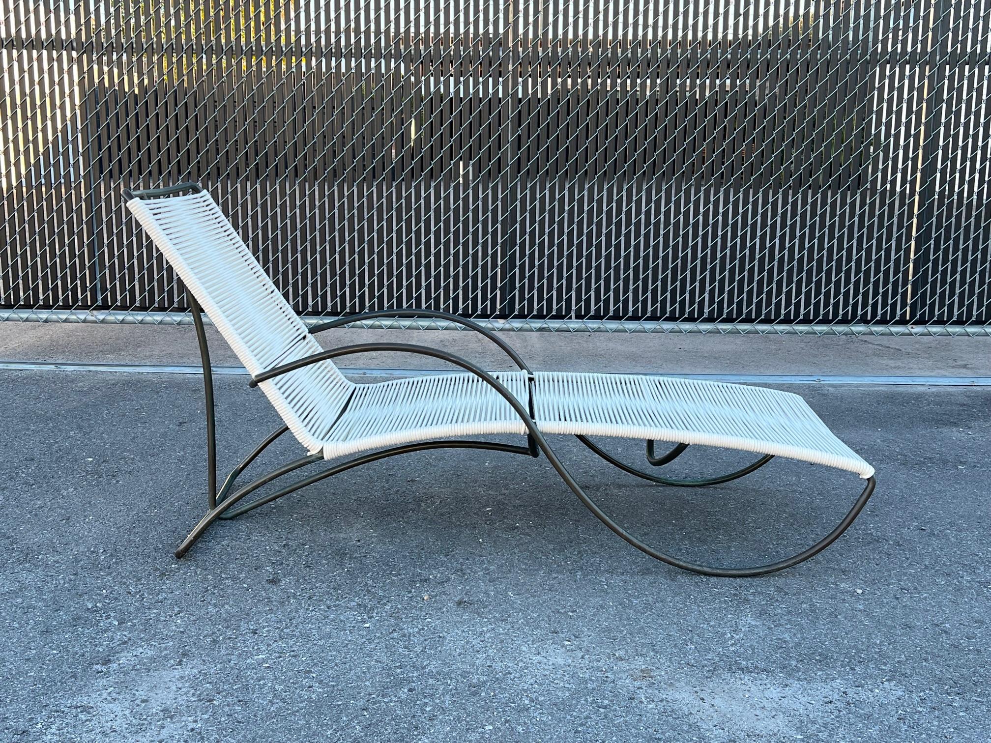 Unusual, early production chaise by Walter Lamb for Brown Jordan, ca' 1950's. Beautiful patina, frame polished, new cotton cording.