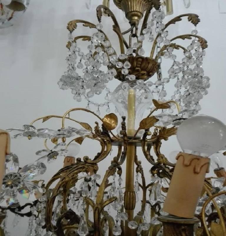 1950, Italy, bronze and crystal
fabulous bronze chandelier and crystals in the shape of grapes with crystal flowers 15 lights chandelier working.