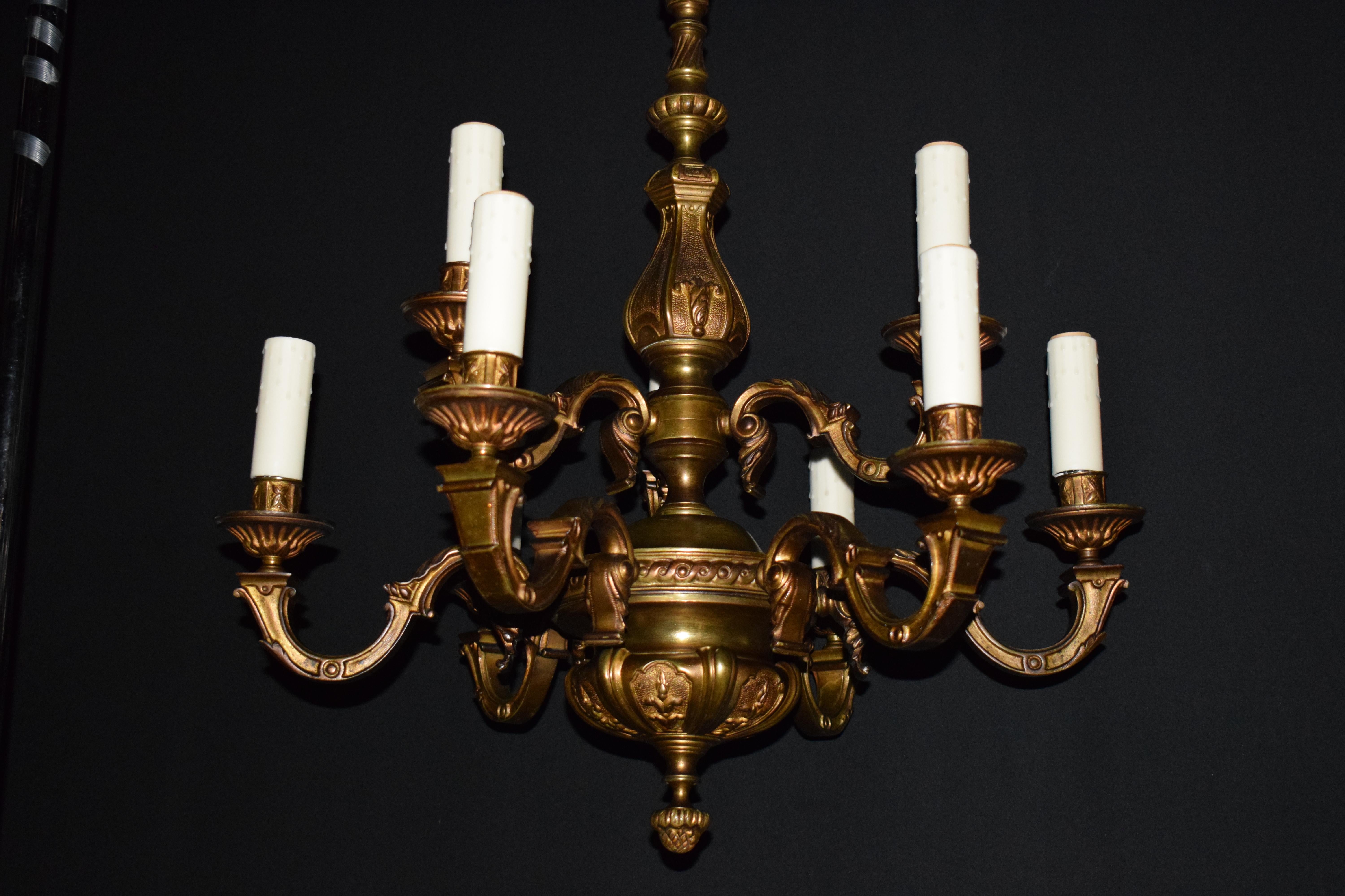 A fine two-tiered bronze chandelier, France, circa 1930

Dimensions:
H 28
