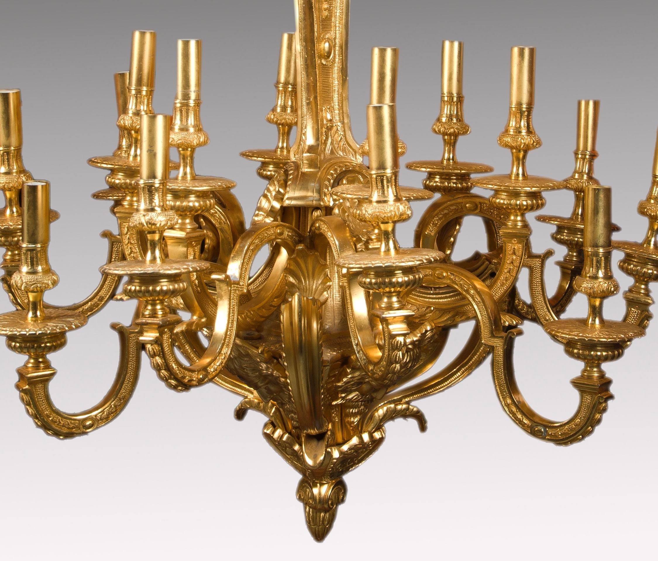 Spider-type ceiling lamp made of gilded bronze and decorated with motifs of garlands, vegetable stems and leaves, gilled shapes and architectural elements all arranged with curves and countercurves, as befits the so-called Louis XVI style, which