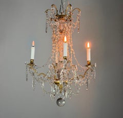 Bronze chandelier with cut crystal drops, around 1800
