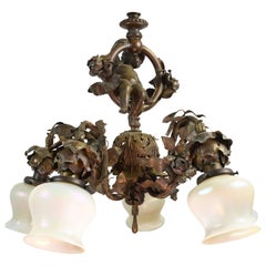 Lampe chérubin en bronze avec abat-jour en verre d'art