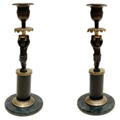 Bronze Cherub "Putti" Candlesticks, Empire or Louis XVI style, 19st century.