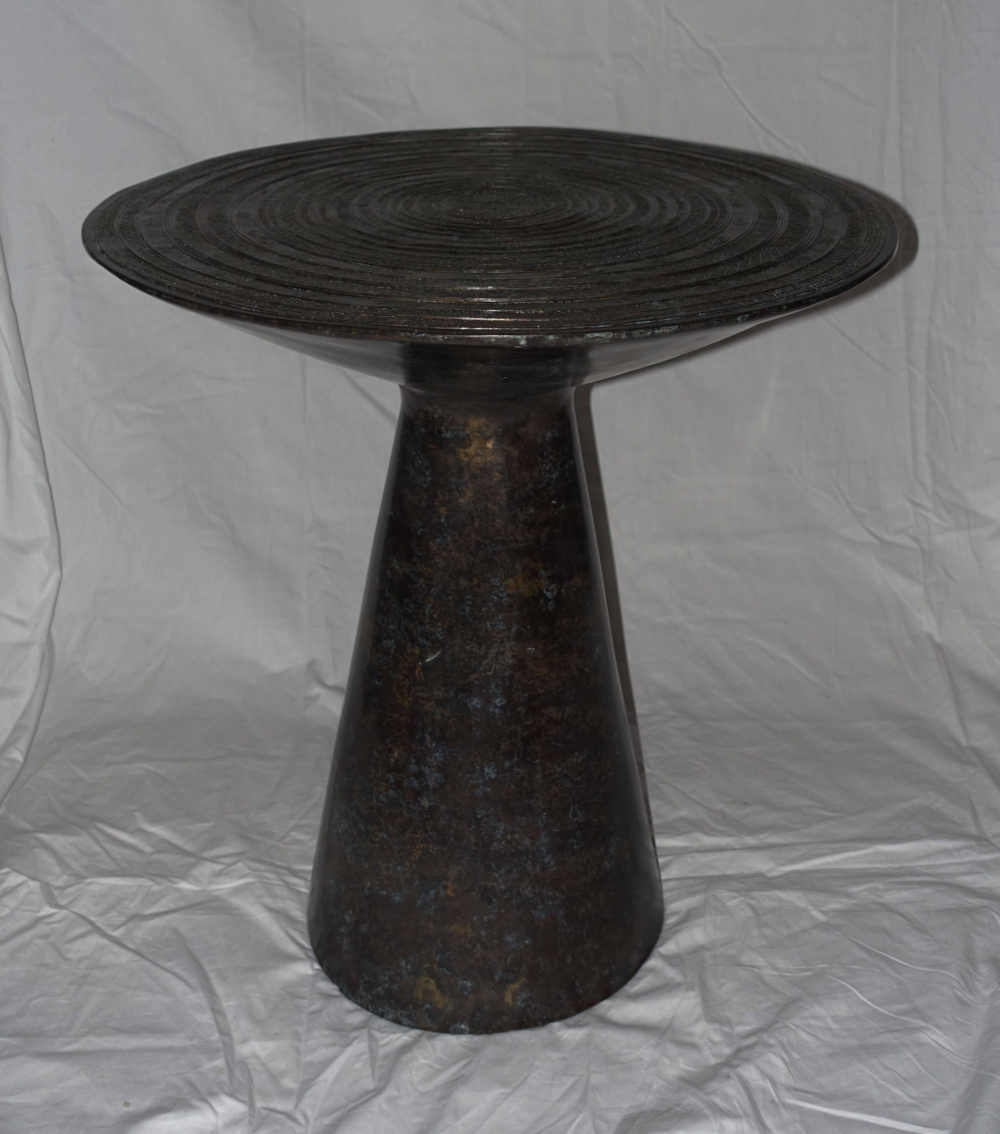 Contemporary Cambodian bronze round side table.
Top was originally a chieftain drum. Now placed on a round pedestal base.
Excellent condition.
  
 