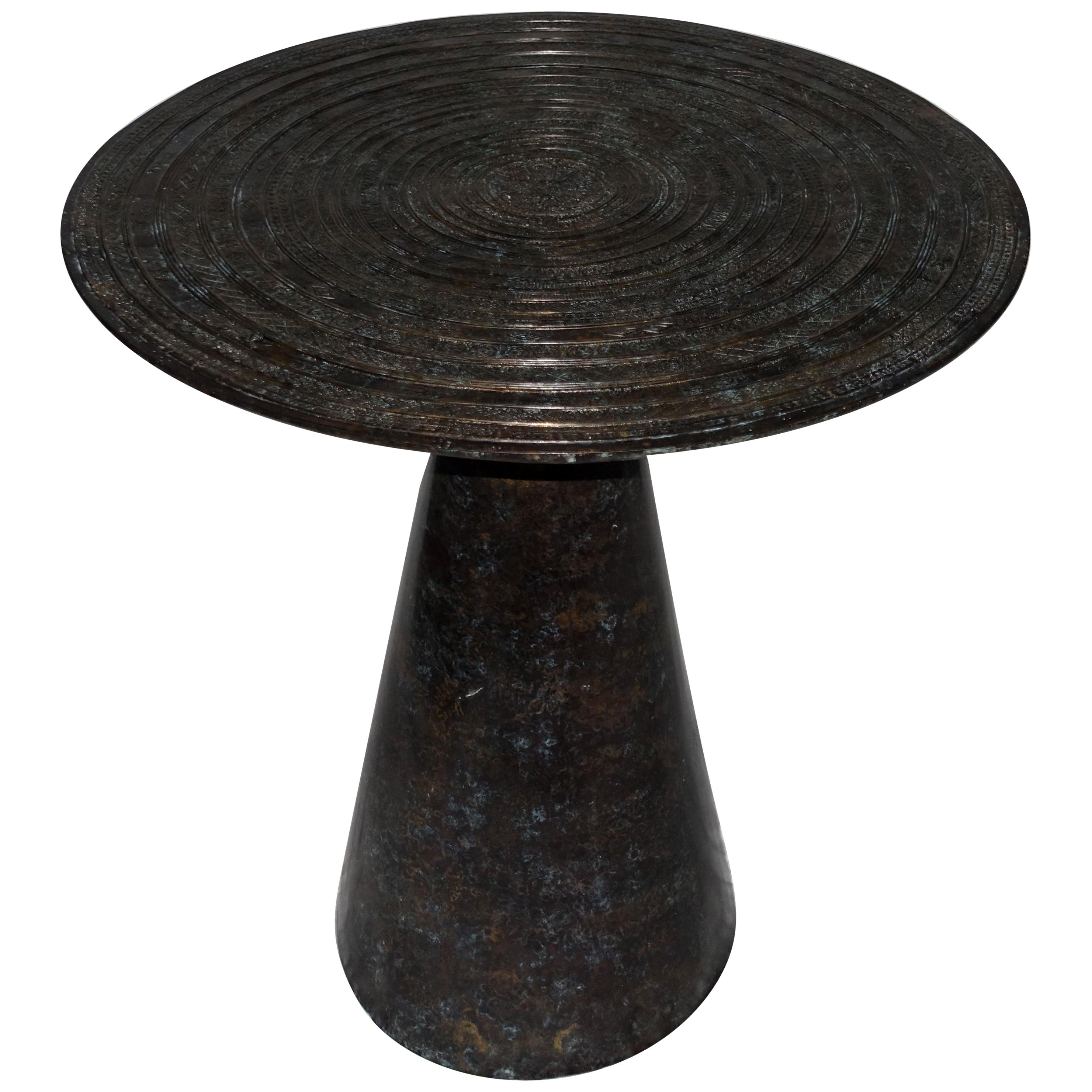 Contemporary German bronze round side table.
Round bronze side table with Cambodian chieftain's drum design.  


 