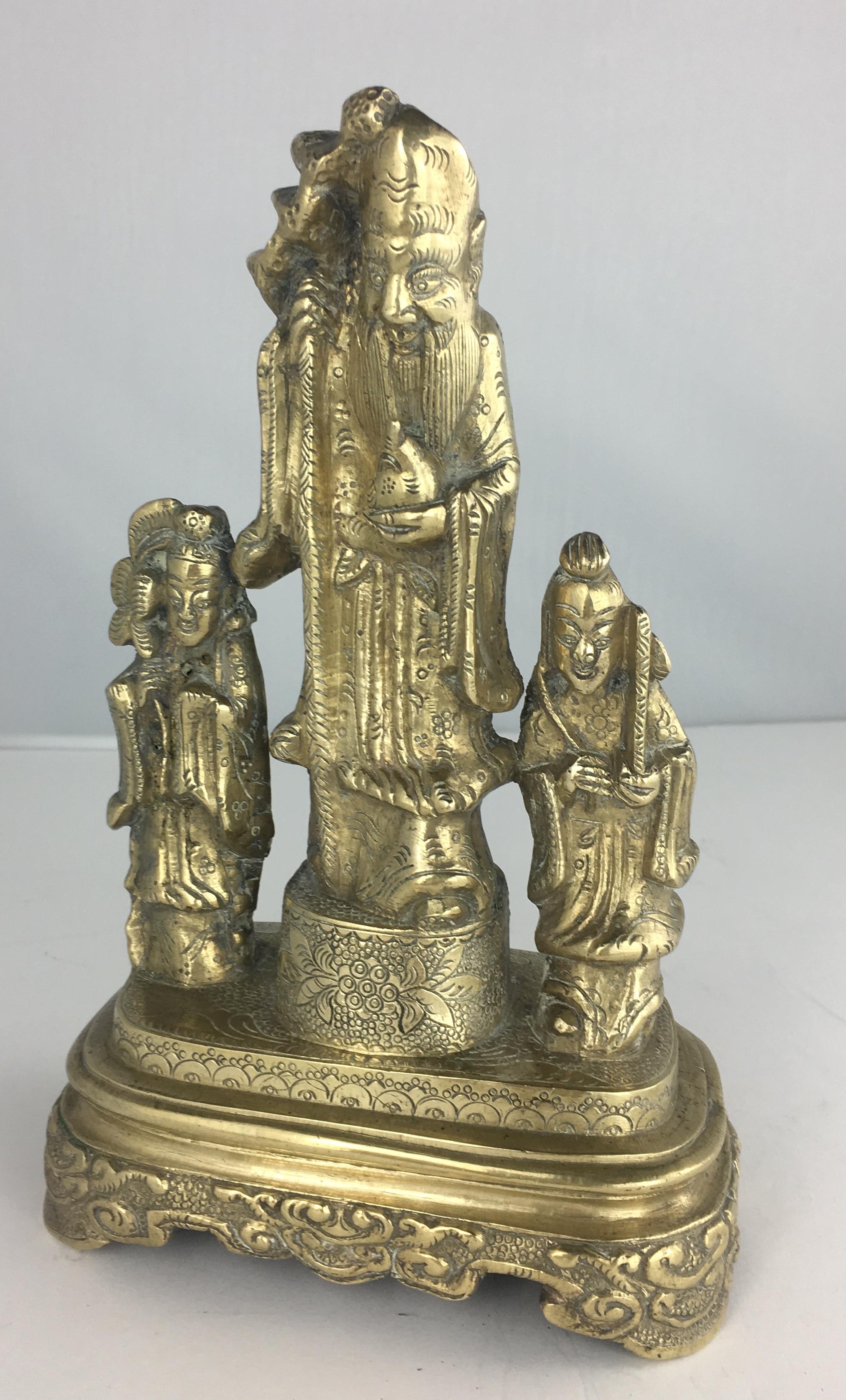 Finely detailed antique bronze of three Chinese figures with a wonderful patina. A beautiful and bold conversation piece for any home. 
Measures: 7 3/4