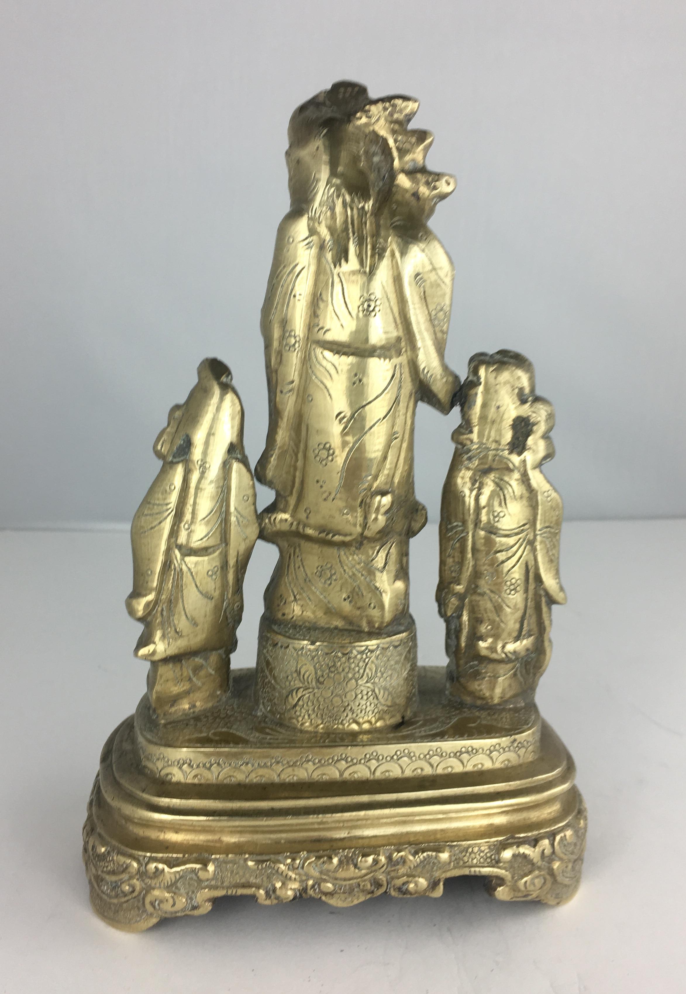 three chinese figures