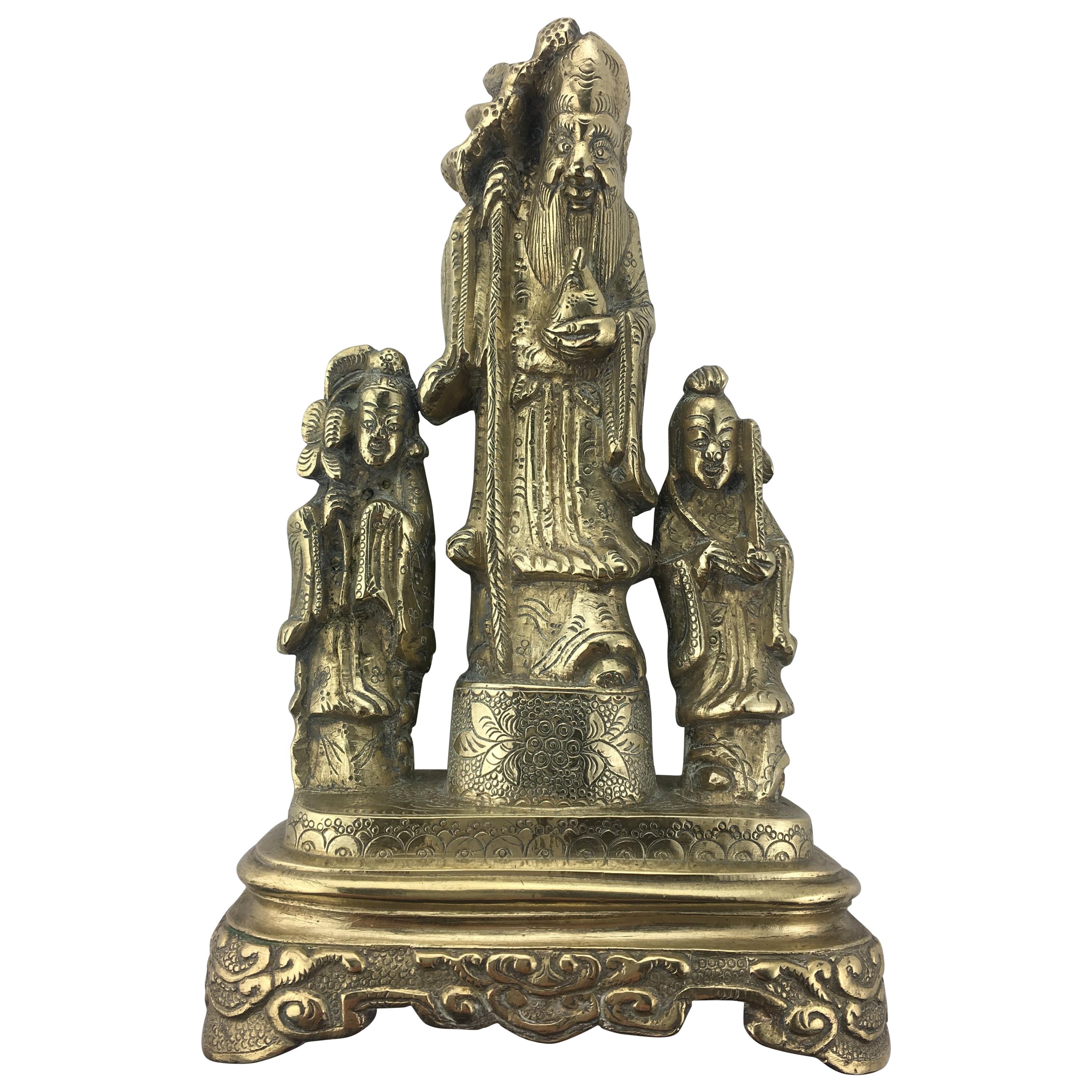 Statue chinoise de trois personnages en bronze