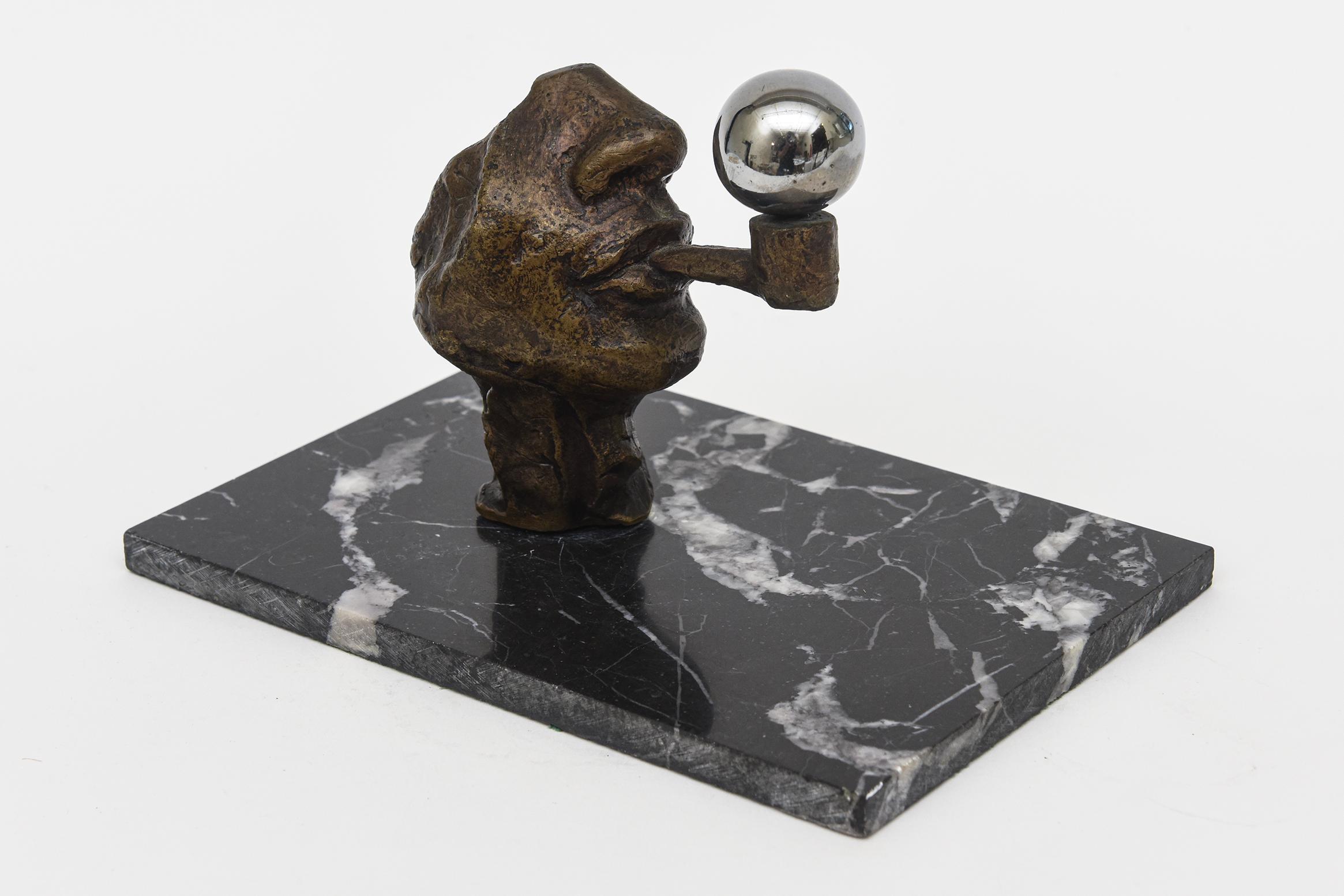 This delightful vintage sculpture by Victor Salmones is from the 80's. It sits on a black and white vintage variegated original marble base and the sculpture head is bronze while the bubble is chrome. The sculptors life span was from 1937-1989. The