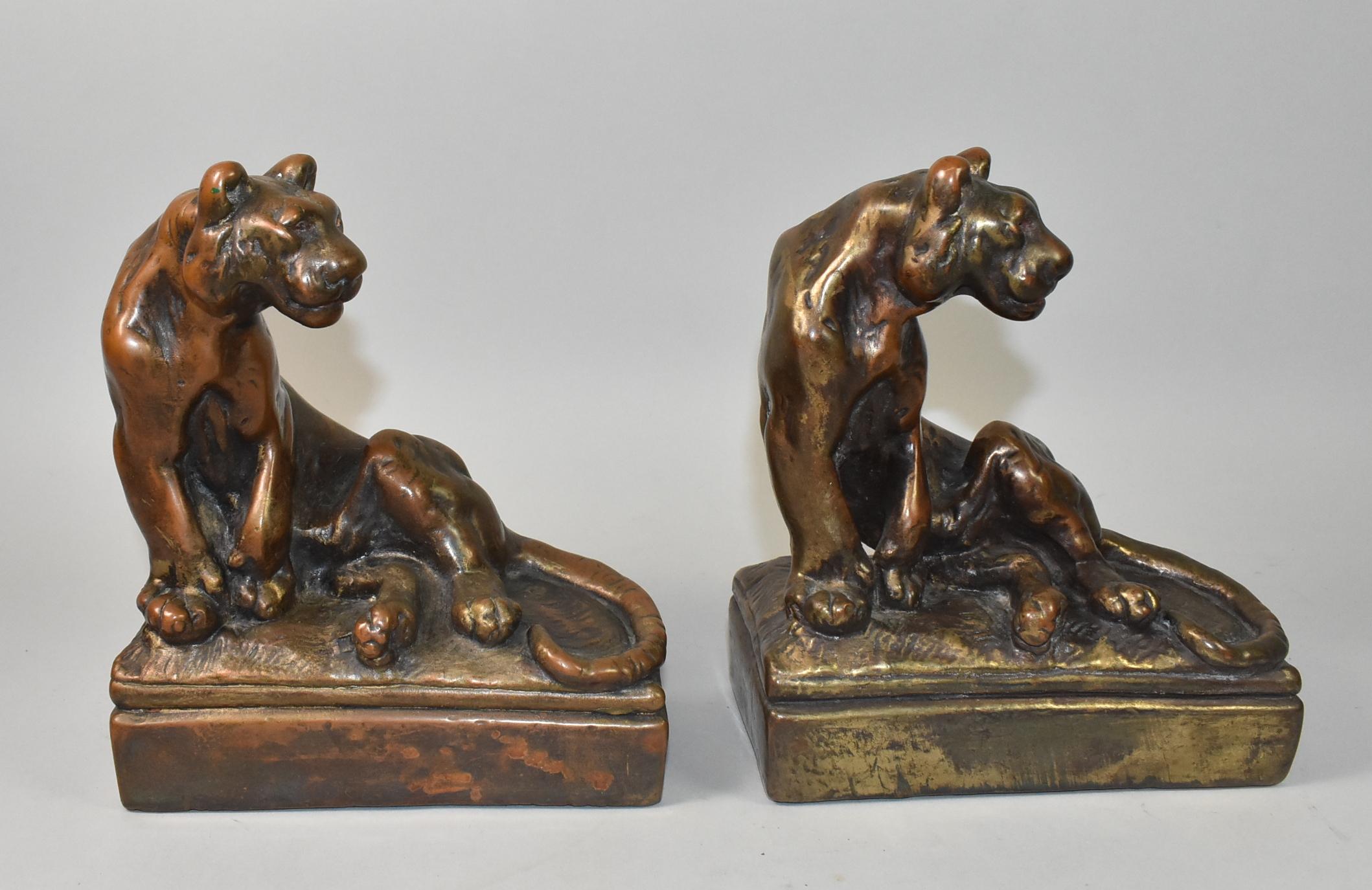 These bronze clad tiger/lion bookends are attributed to Paul Herzel for Pompeian Bronze. These bookends have a beautiful patina and are circa 1920's. These pieces are unmarked, 6