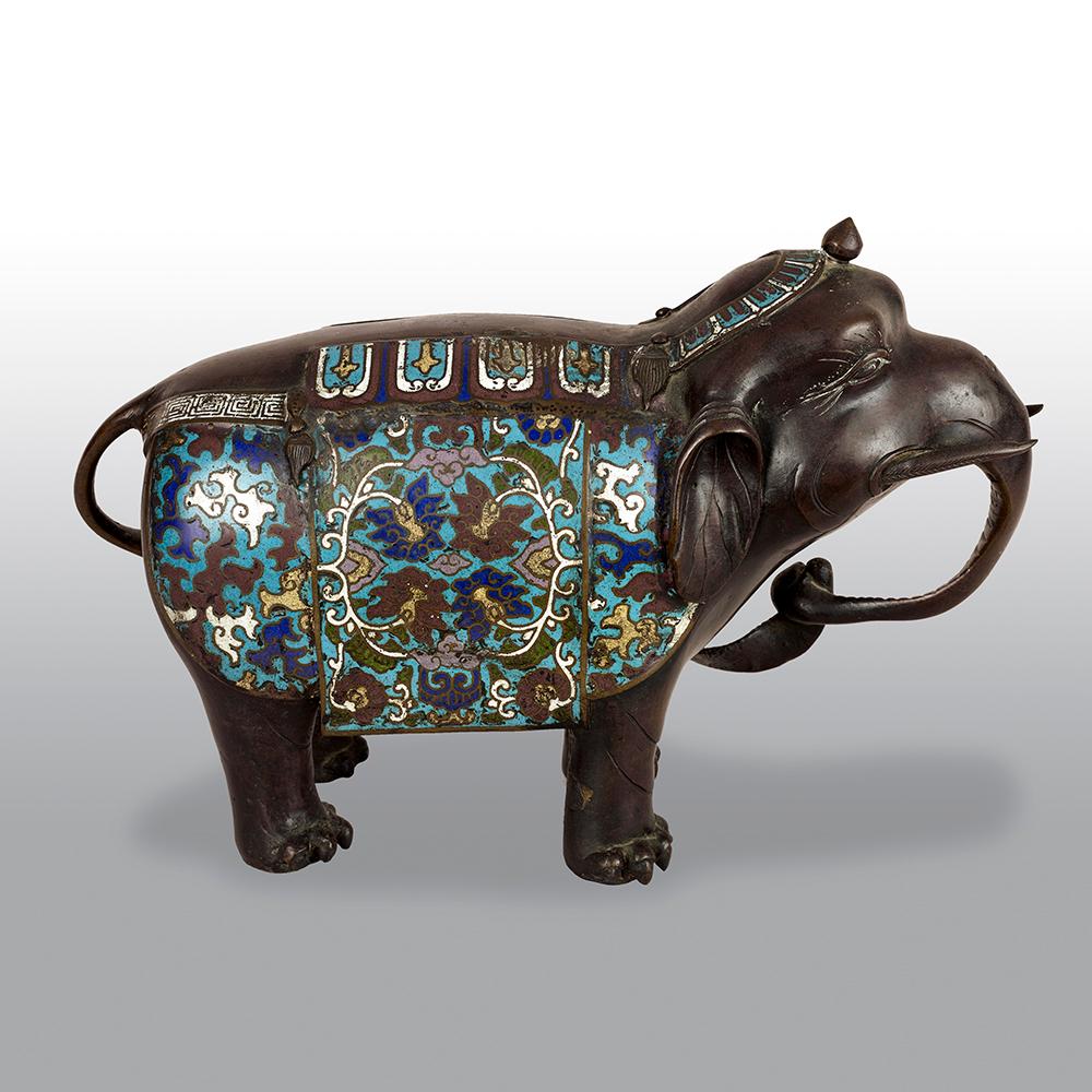 A Japanese bronze champlevé enamel elephant of fine proportions.