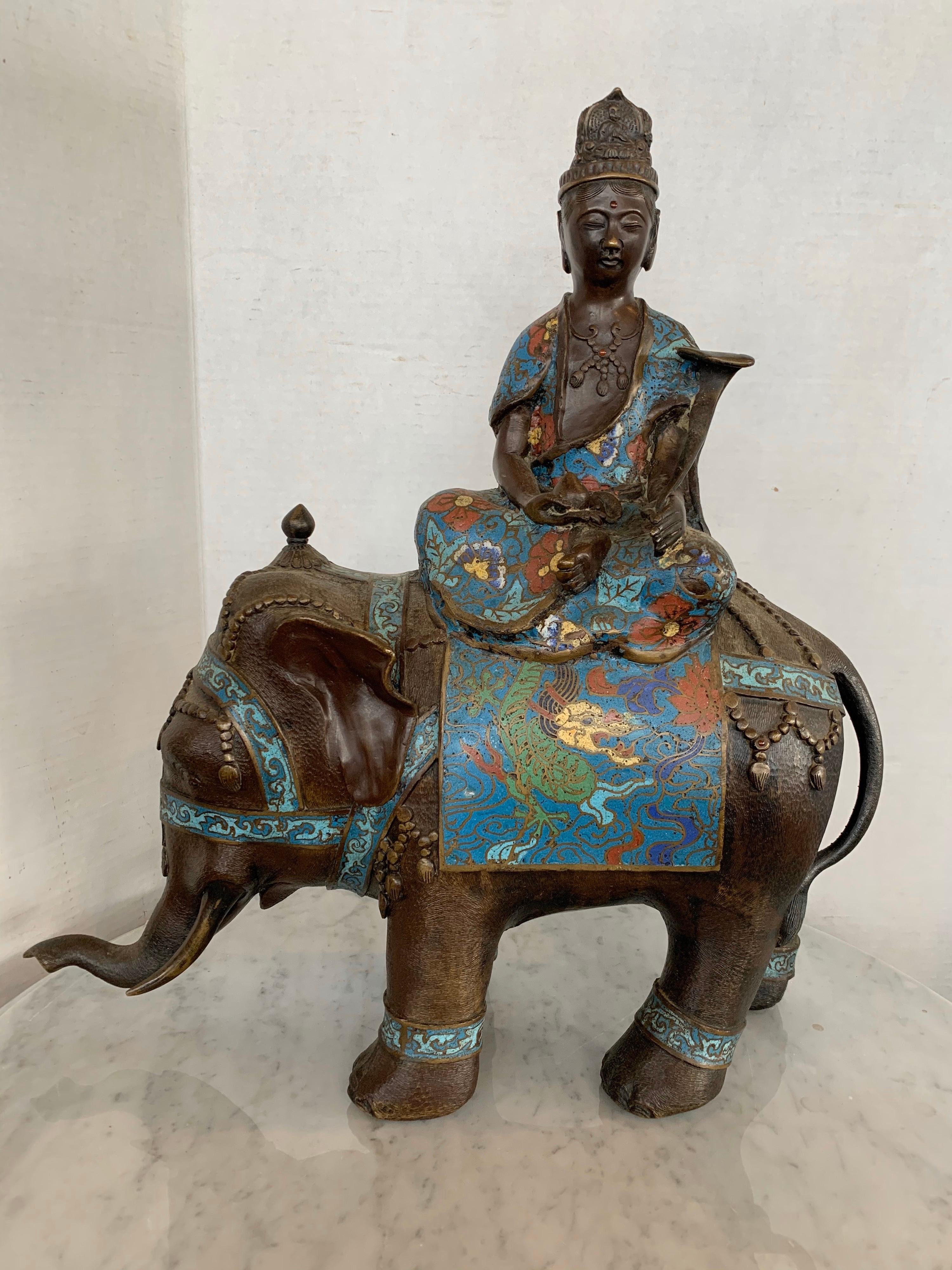 Magnificent bronze and cloisonne enamel large and heavy Asian sculpture of a buddha riding on an elephant. Intricate detail throughout.