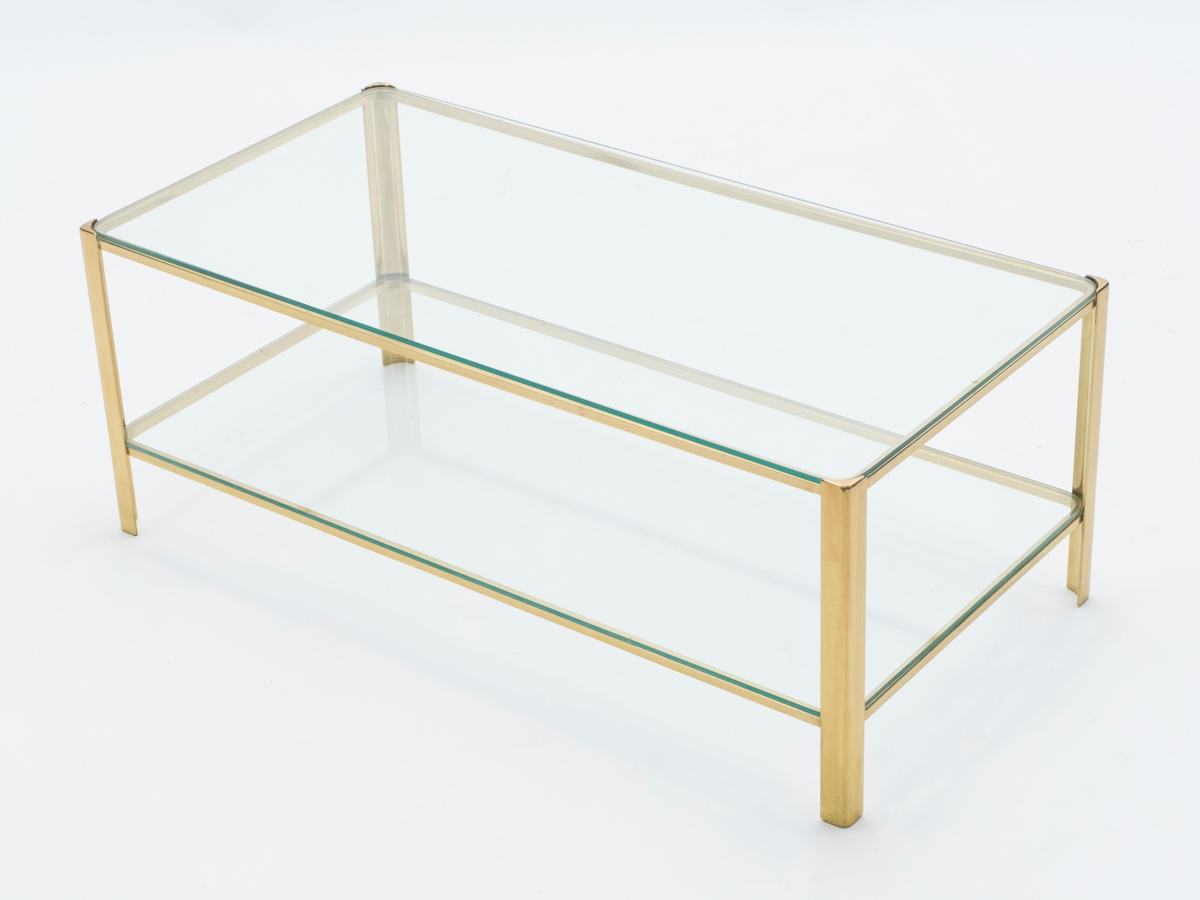 This coffee table signed by Jacques Quinet and stamped by Broncz, is a remarkable find. It features a strong, bronze base constructed to last. The 2/3 glass top adds extra storage space as well as aesthetic appeal. This coffee table will not only be