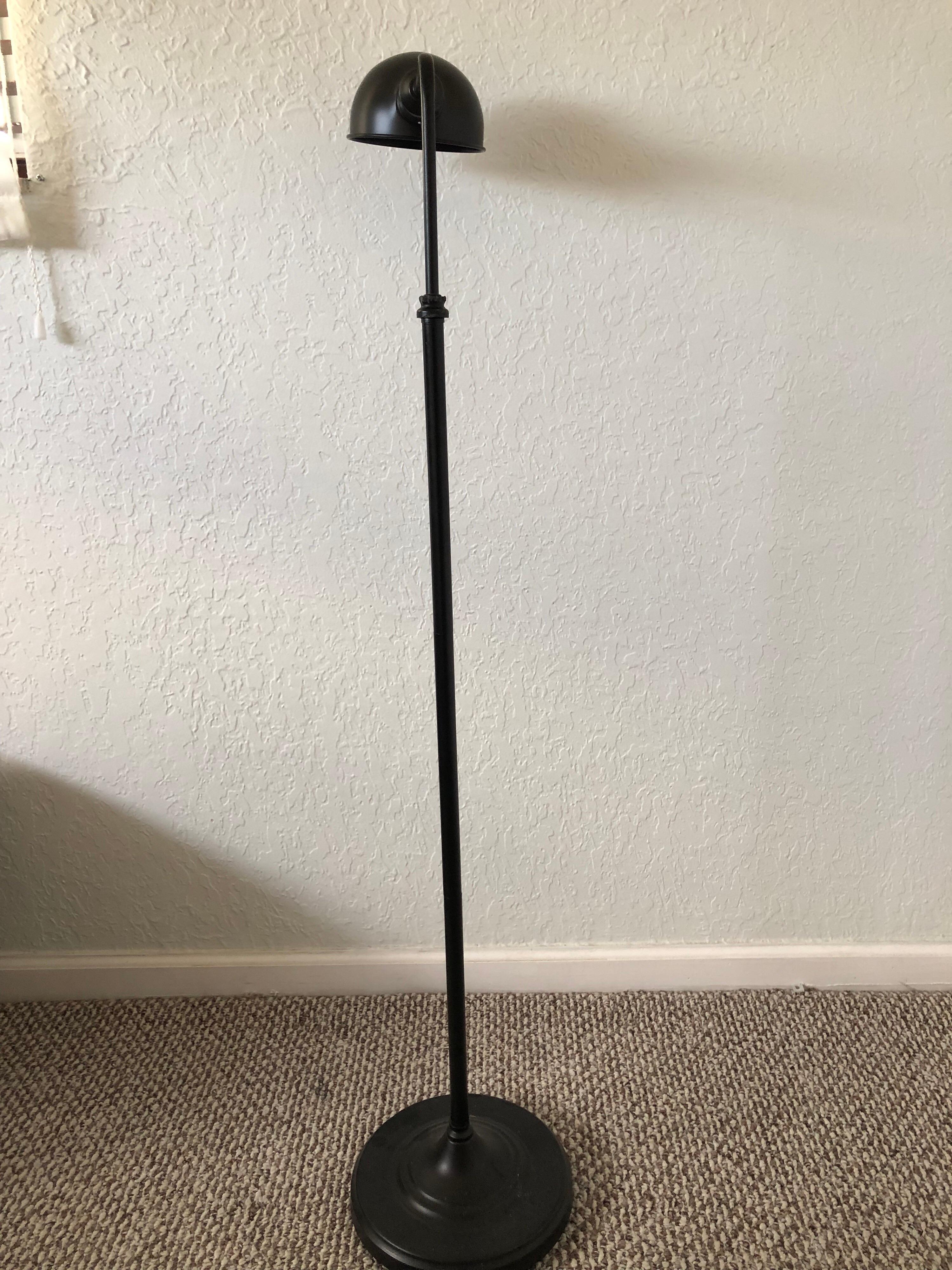 Bronze color metal floor lamp with round shade.
Size: 10