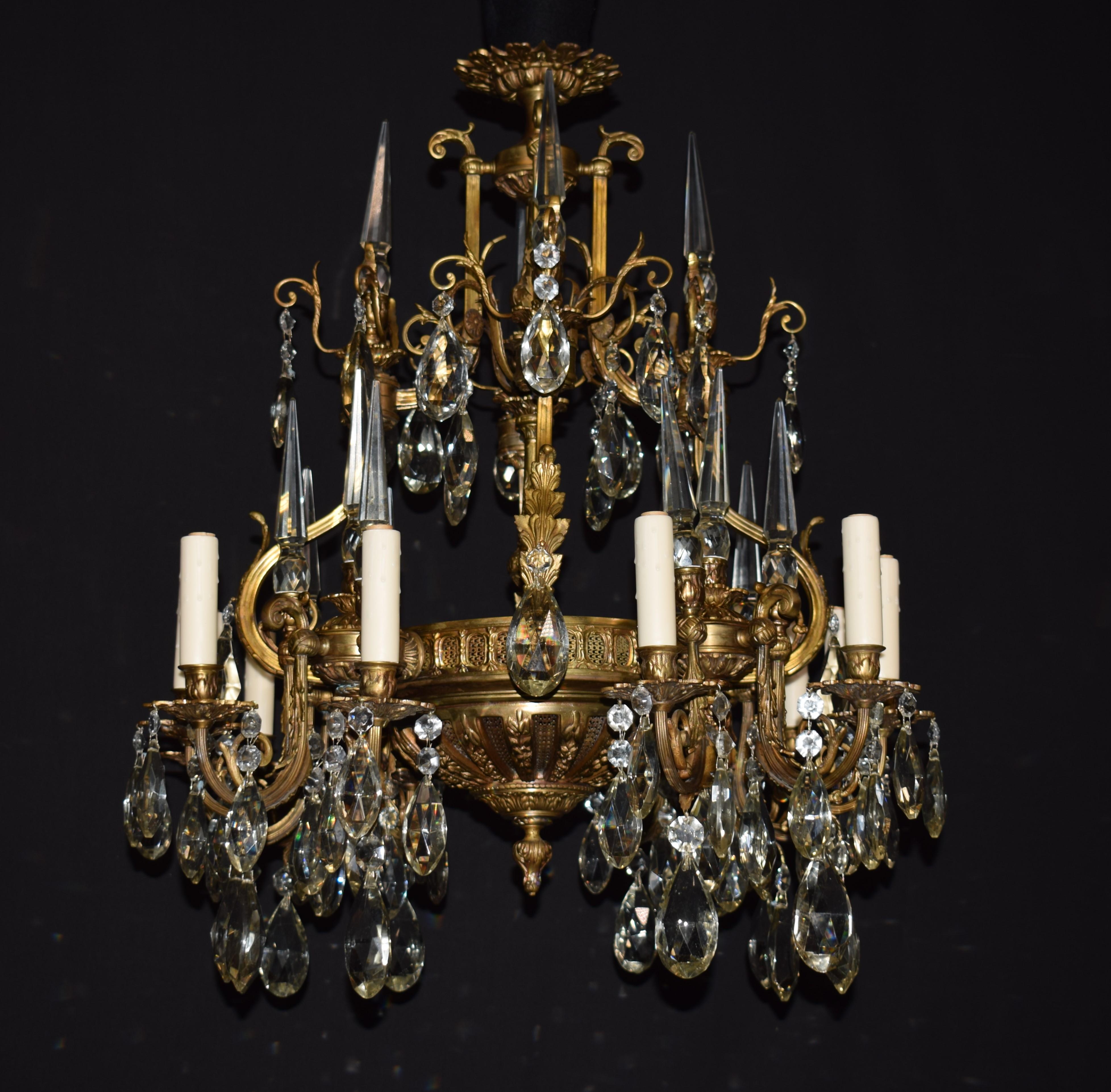 A fine gilt bronze and crystal Neoclassical chandelier, France, circa 1930.
Dimensions:  H: 33