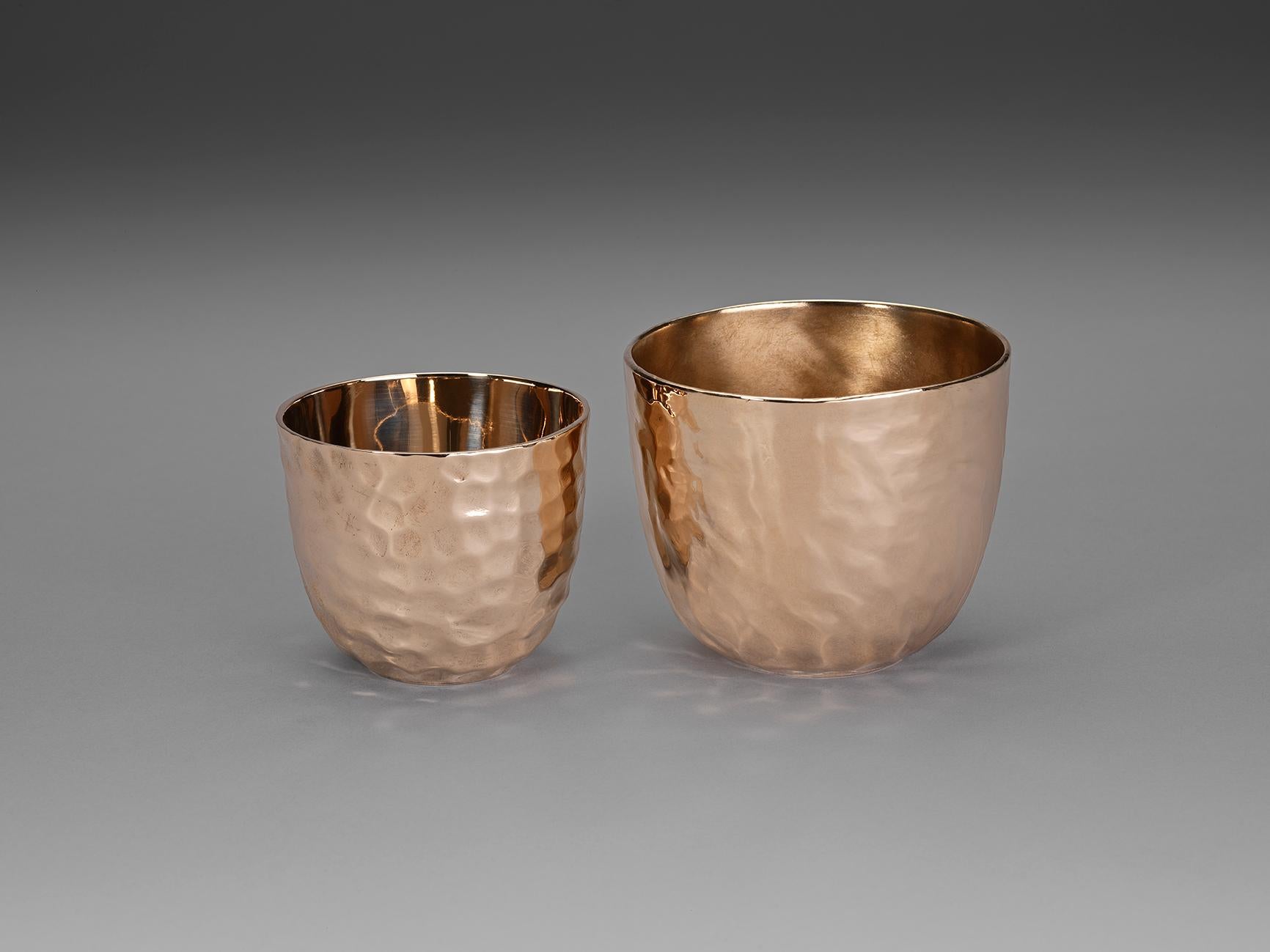 A highly polished bronze cup with hand-wrought exterior. It holds 250ml