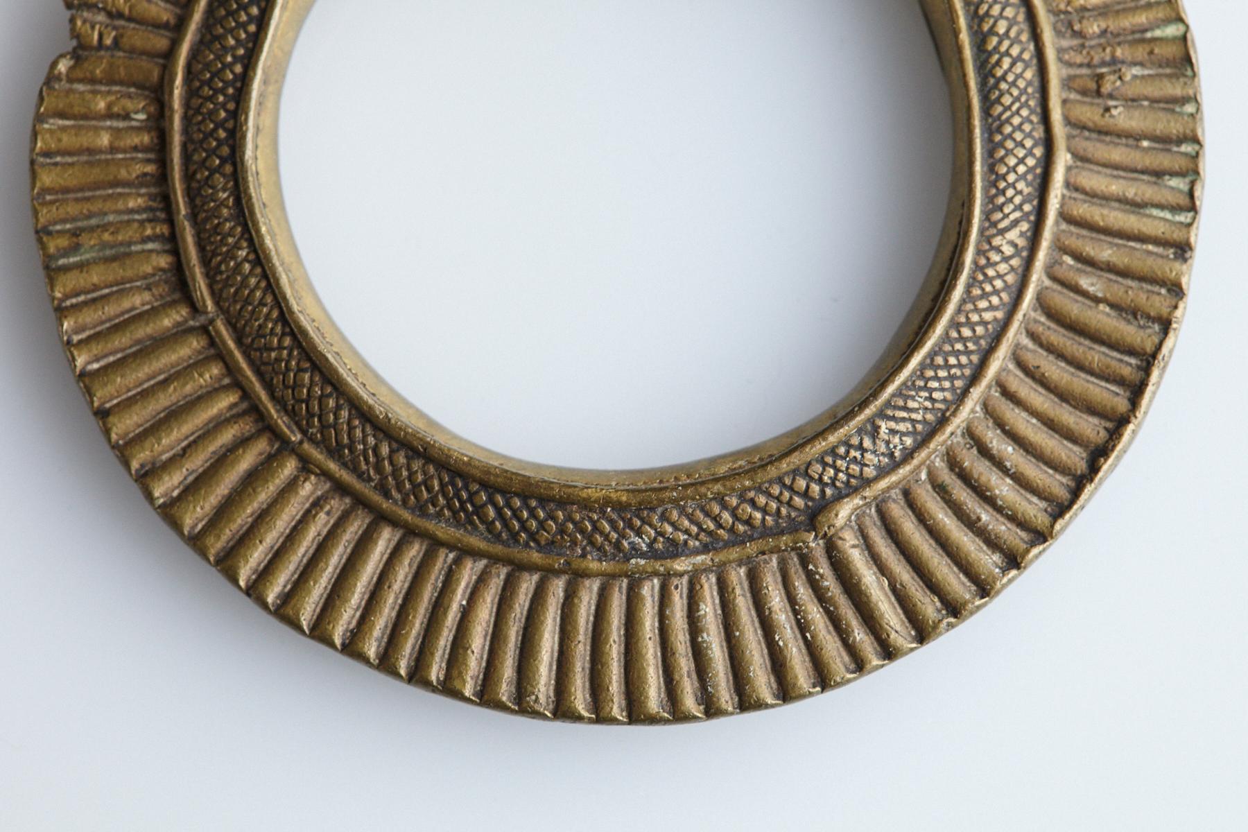 Early to mid-19th-century bronze currency bracelet / Manilla in circle form. Intricate graphical geometrical. This type of bracelet was worn/used by the Zaghawa People also called Béri People, an ethnic group primarily residing in southwestern