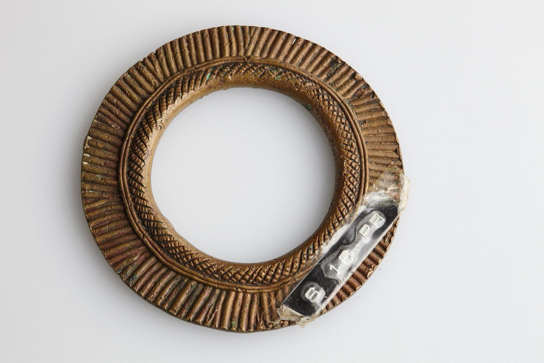 Early to mid-19th-century bronze currency bracelet / Manilla in circle form. Intricate graphical geometrical. This type of bracelet was worn/used by the Zaghawa People also called Béri People, an ethnic group primarily residing in southwestern