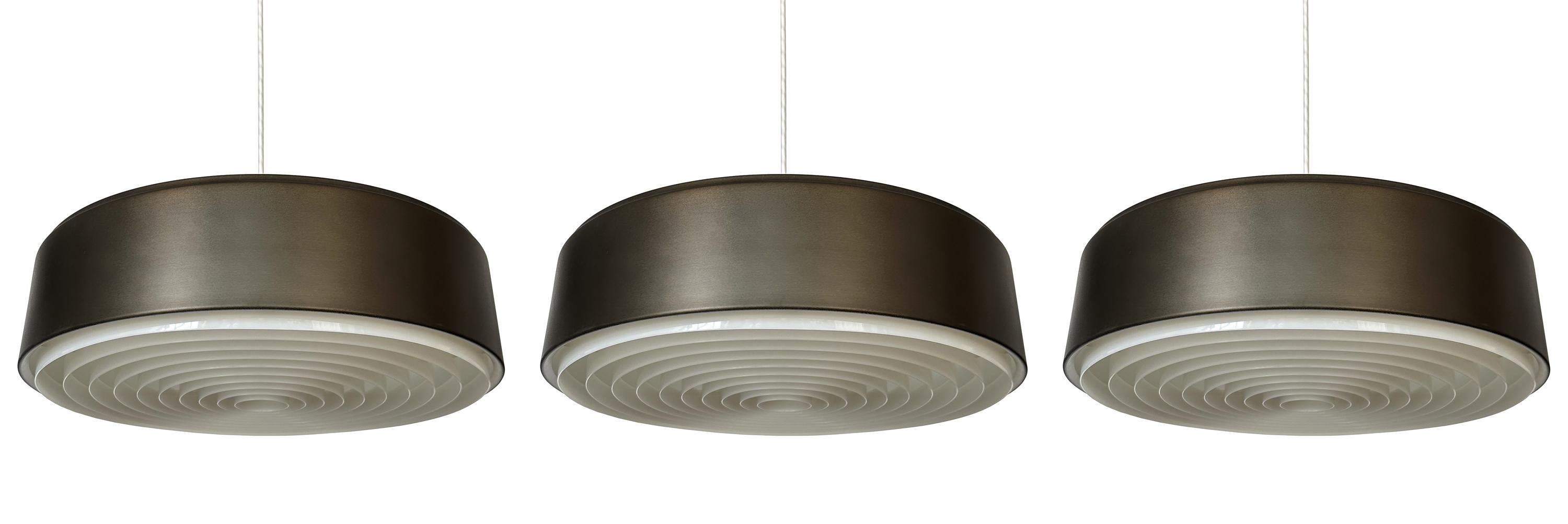 Elevate your interiors with the subtle sophistication of Sven Middelboe's pendant lamp for Nordisk Solar, a rare gem from Denmark's golden age of design, circa 1960s. Model 74212, with its durandoic bronze (brown black)  finish over spun aluminum,