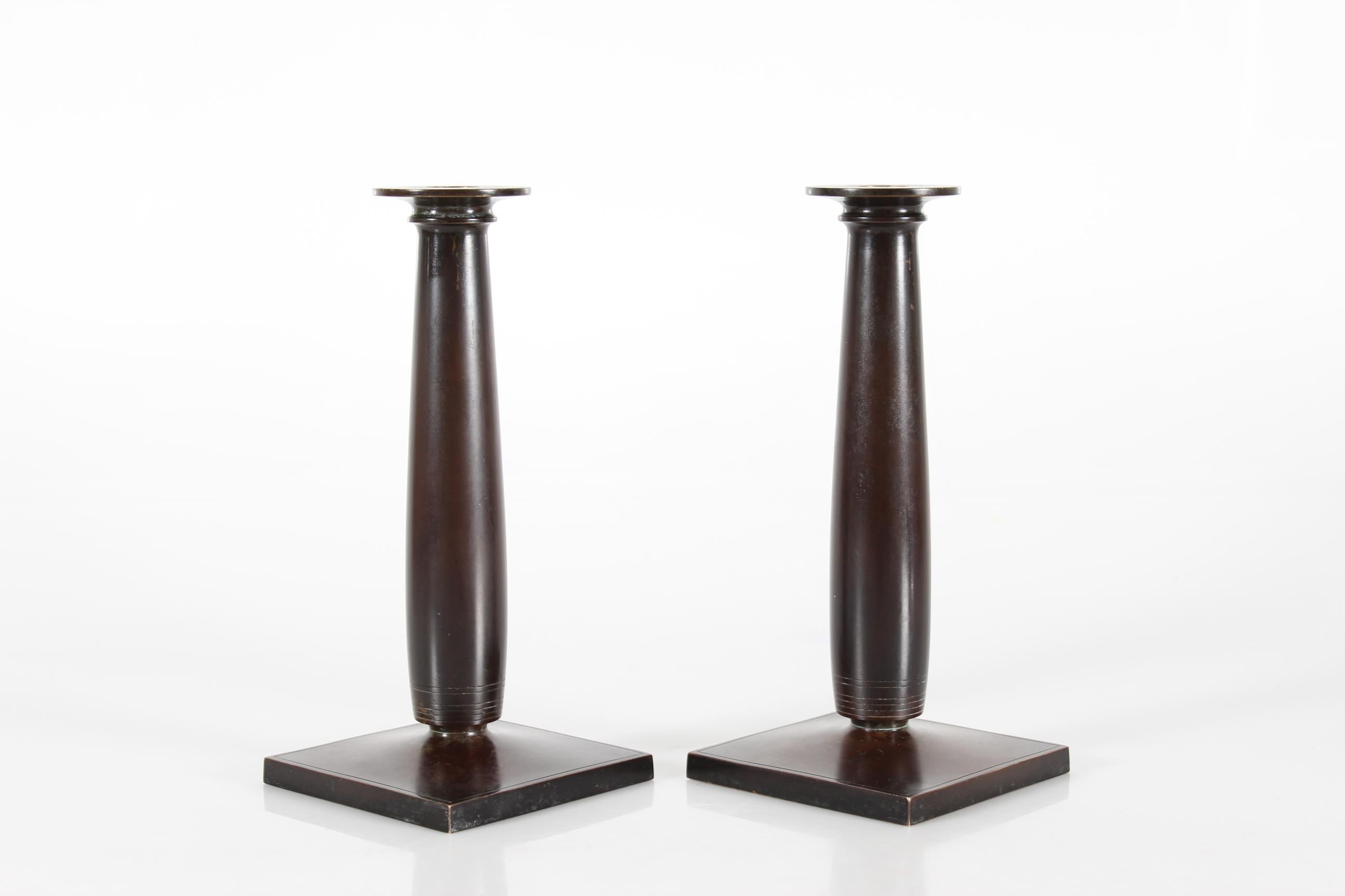 High Danish Art Deco candle sticks model no. B 155 designed by artist Just Andersen (1884-1943) in the 1930s.
They are made of solid bronze with deep brown patina by Just Andersen´s own metal workshop.
Stamped with monogram for Just Andersen and B