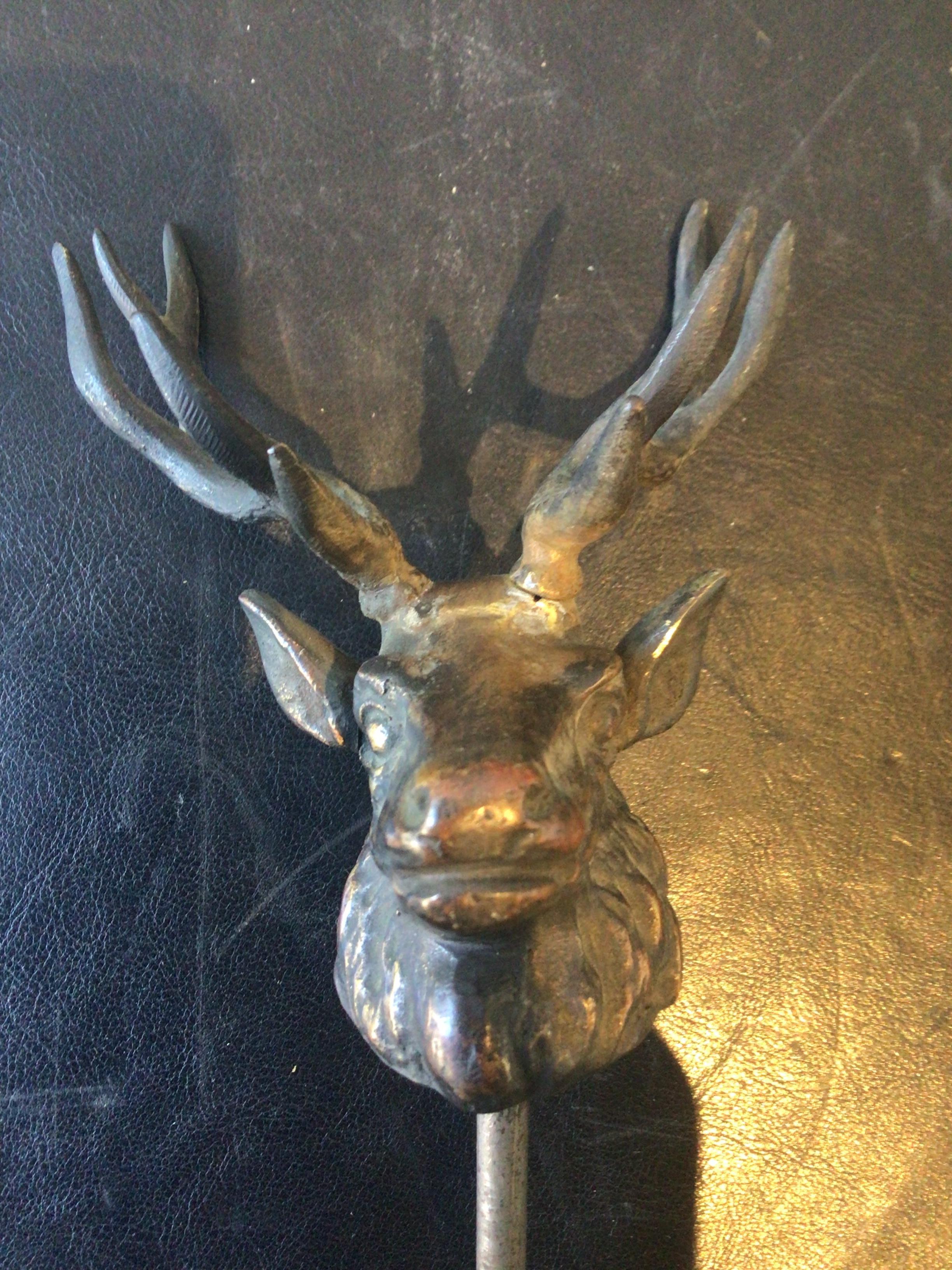 Bronze male deer head. The height of the head without the rod is 4.25”.