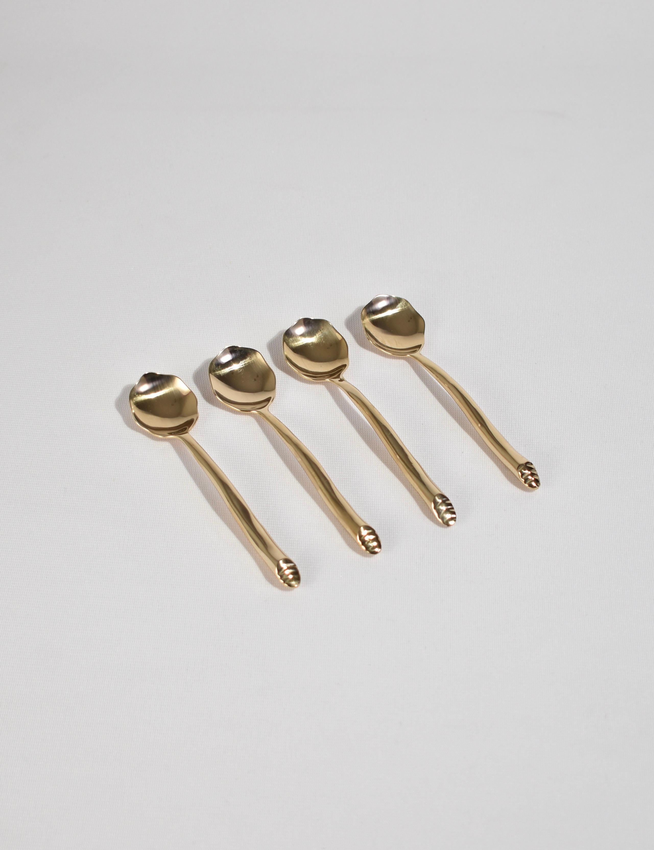 Beautiful, 4 piece bronze demitasse spoon set in 'Shore' pattern. Each piece is hand-forged and features an undulating handle with angled end. Impressed above end 'IZABEL LAM'. 

Designed in the late 1980s by Izabel Lam, available exclusively on