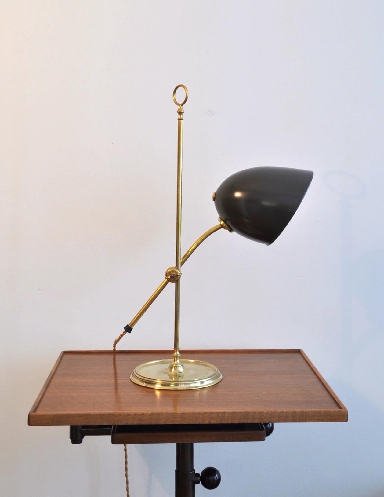 Transitional desk lamp designed and manufactured by the Swiss power house bronze work shop, BAG Turgi, Switzerland. The arm can be adjusted to accommodate an ideal lighting requirement.
Height measurement below is for the lamp is full vertical