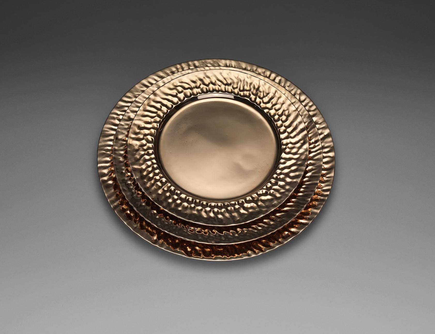 A bronze dessert plate with sculptural lip. Cast by lost wax technique. The plate can be used functionally or decoratively. Great care has been taken with the weight and thickness. They are as thin as porcelain and the weight is satisfying but not