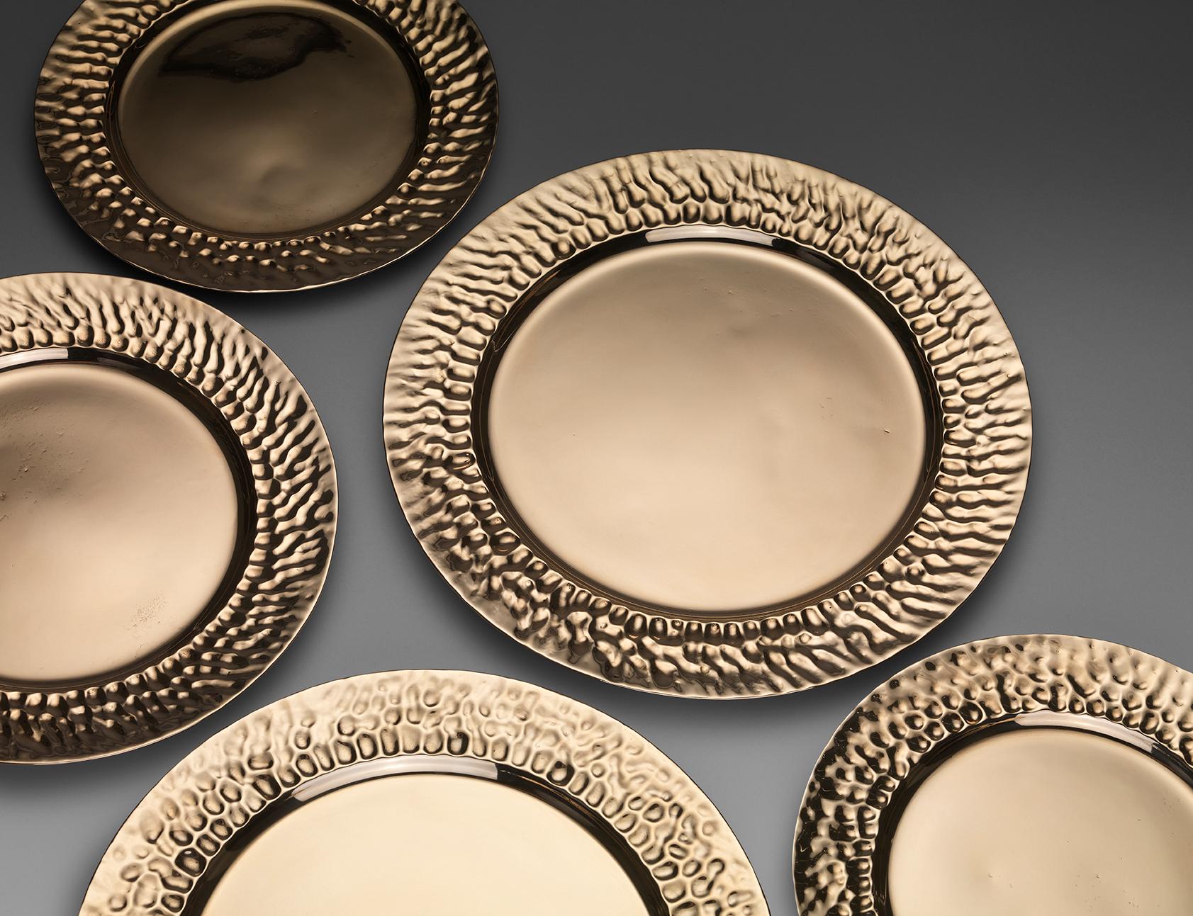 A bronze dinner plate with sculptural lip. Cast by lost wax technique. The plate can be used functionally or decoratively. Great care has been taken with the weight and thickness. They are as thin as porcelain and the weight is satisfying but not