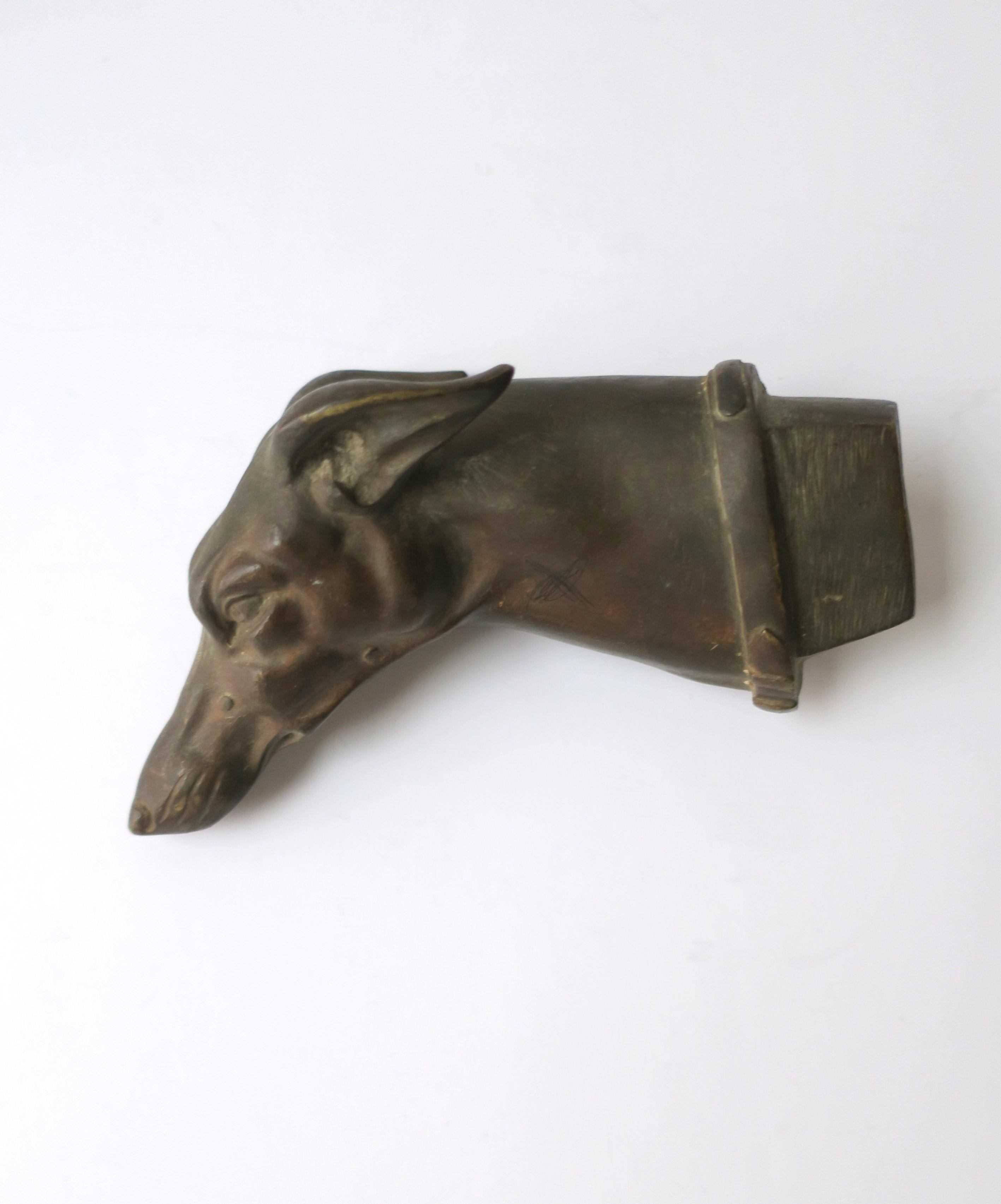 A beautiful and substantial solid bronze dog head of a Greyhound or Whippet, Art Deco period, circa early-20th century, Europe. England or France. This heavy bronze dog has a detailed face (snout, ears, eyes) and collar. A great collectable piece;