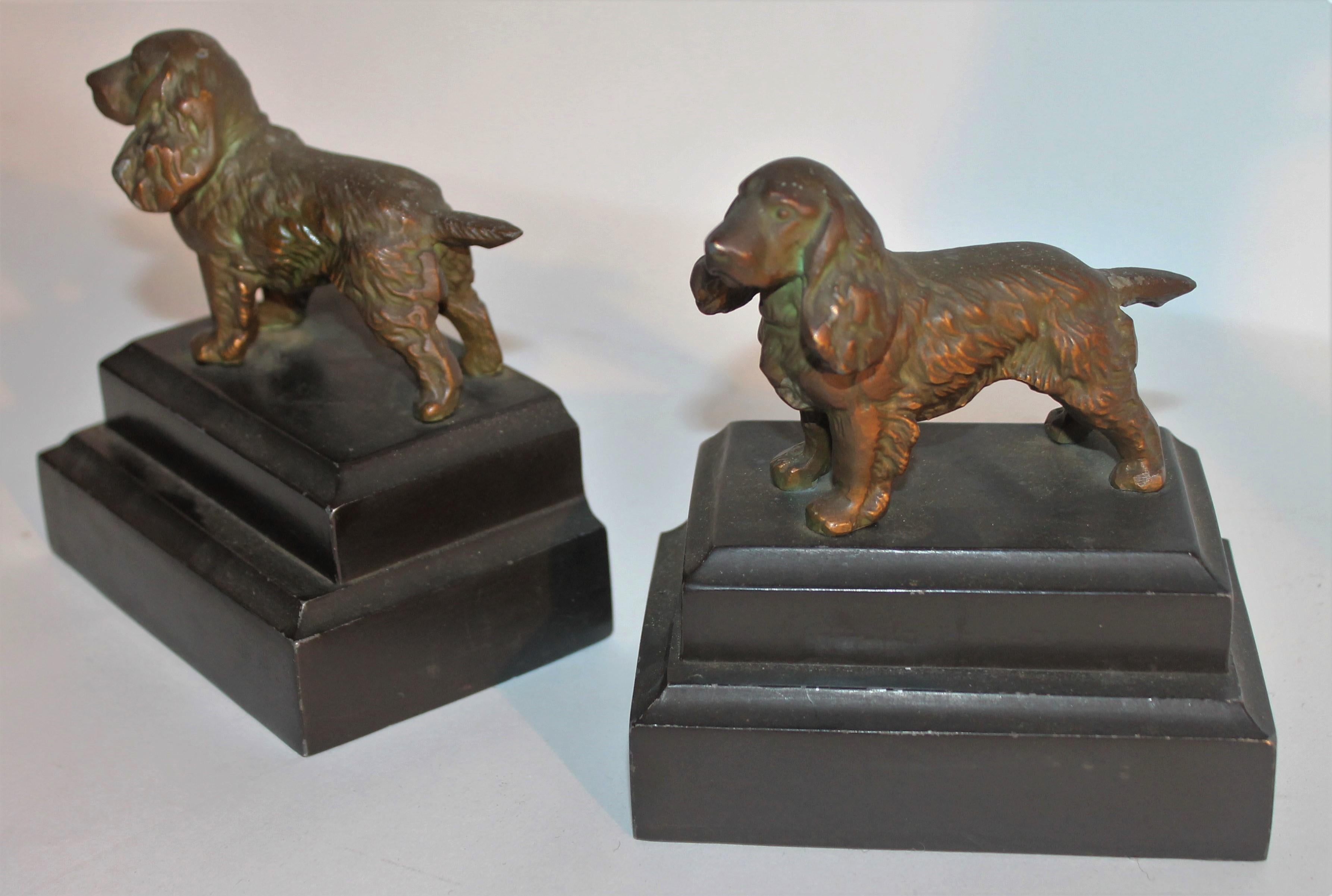 This pair of bronze dog book ends are in fine condition with a nice patina. They are in very good condition.