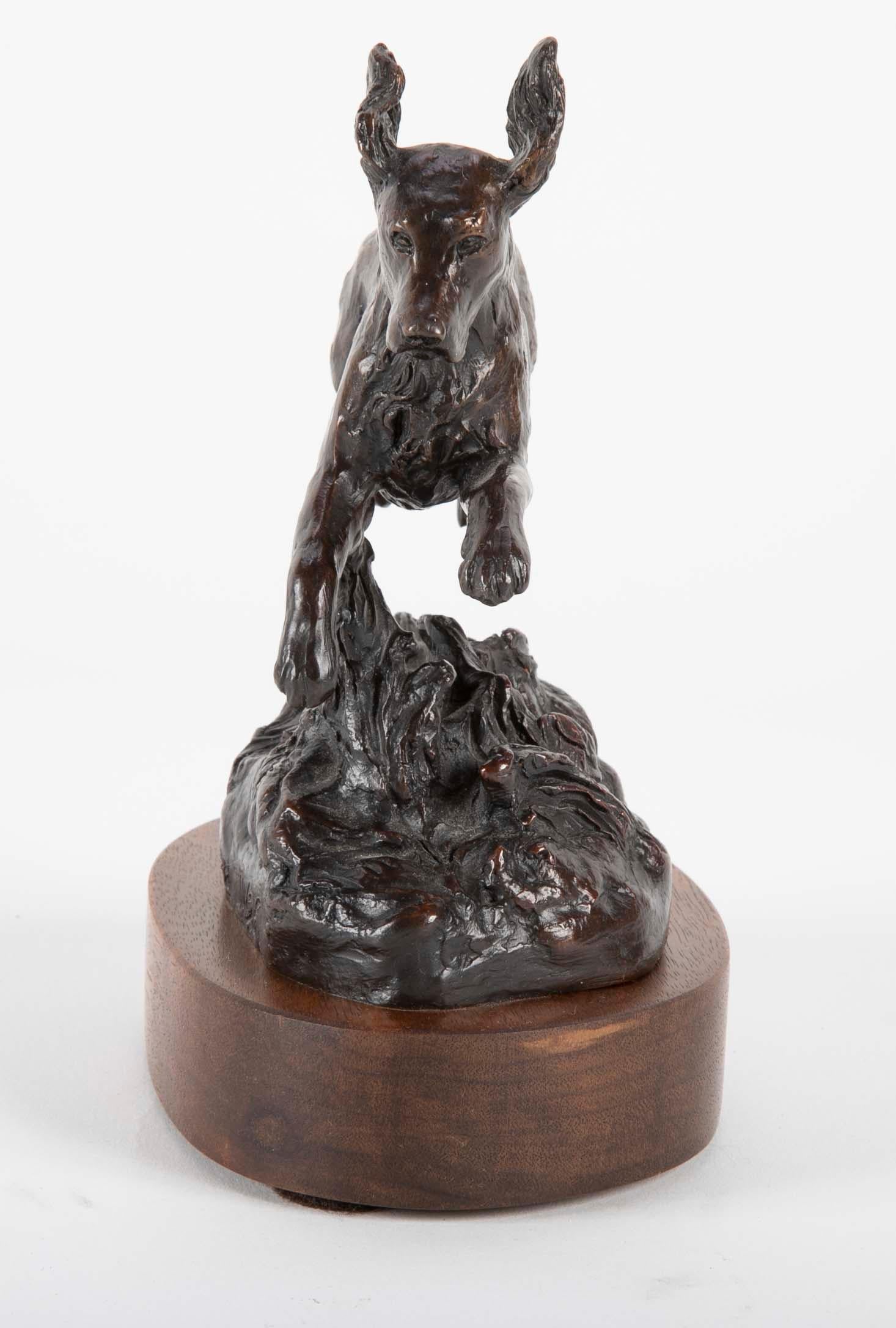A charming depiction of a jumping Airborne dog catches the enthusiasm and joy of the animal. A great gift for dog lovers. Signed on base.

Bunny Connell, Wyoming sculptor, looks almost exclusively to the animal world for her inspiration,