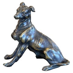 Escultura de perro de bronce